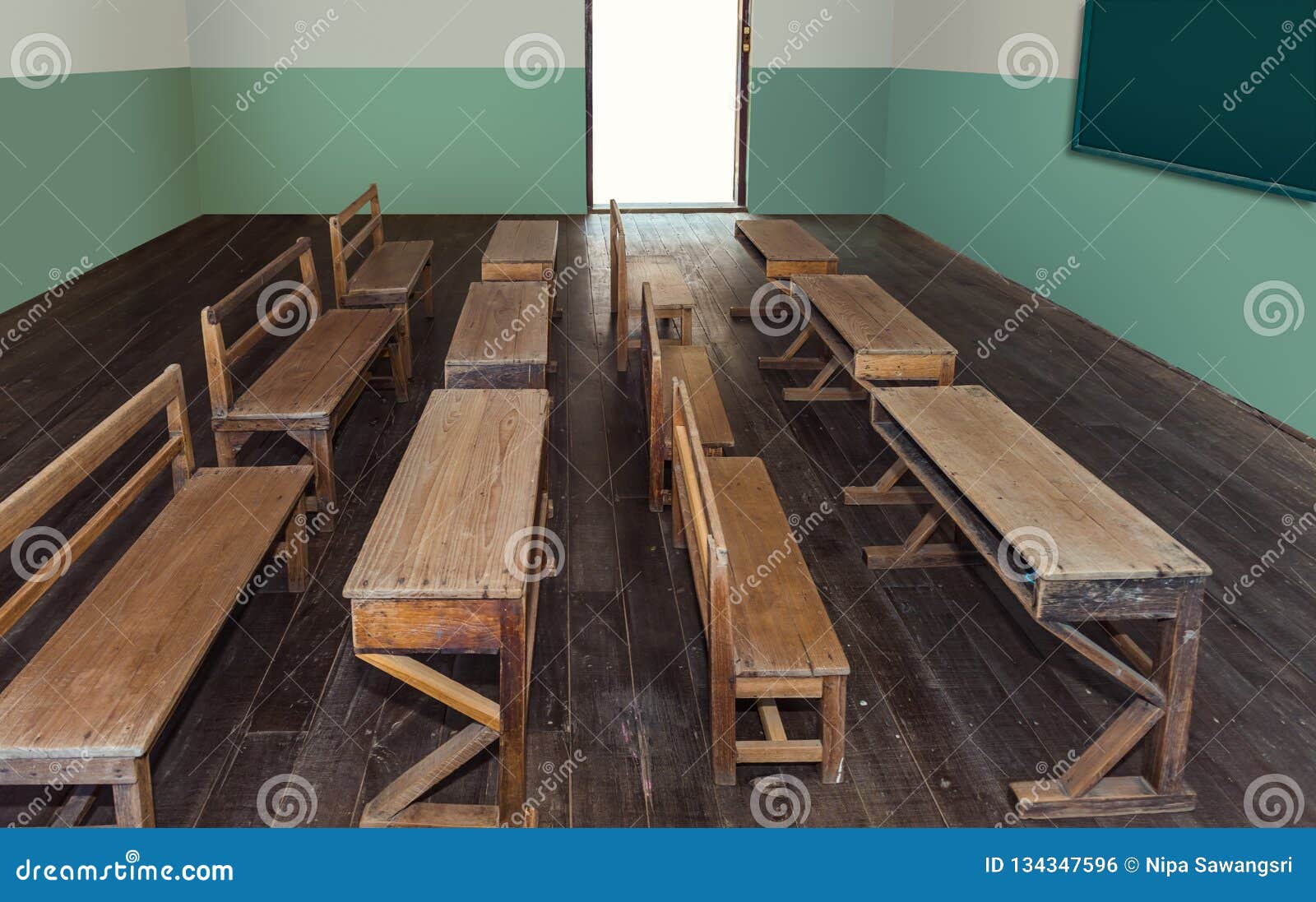 Antique Classroom In School With Rows Of Empty Wooden Desks Stock