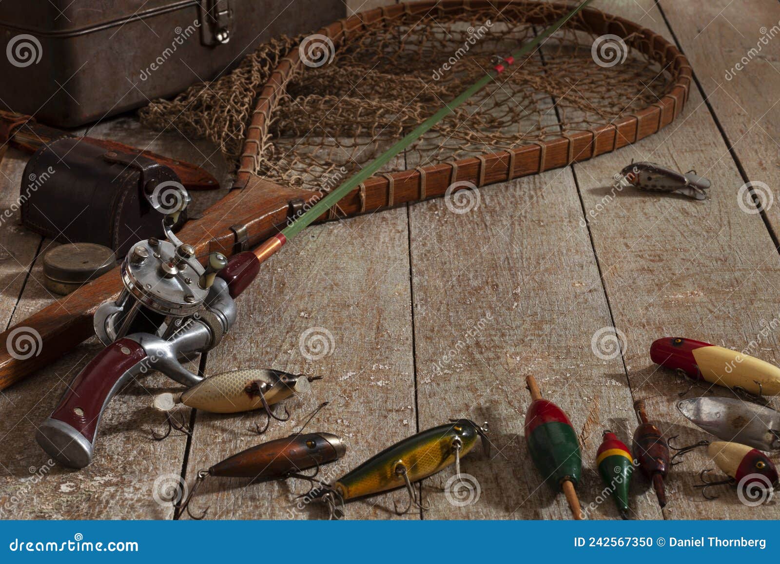 Antique Fishing Rod with Lures Net Bobbers and Tackle Box on Grunge Wood  Surface Stock Photo - Image of hooks, line: 242567350