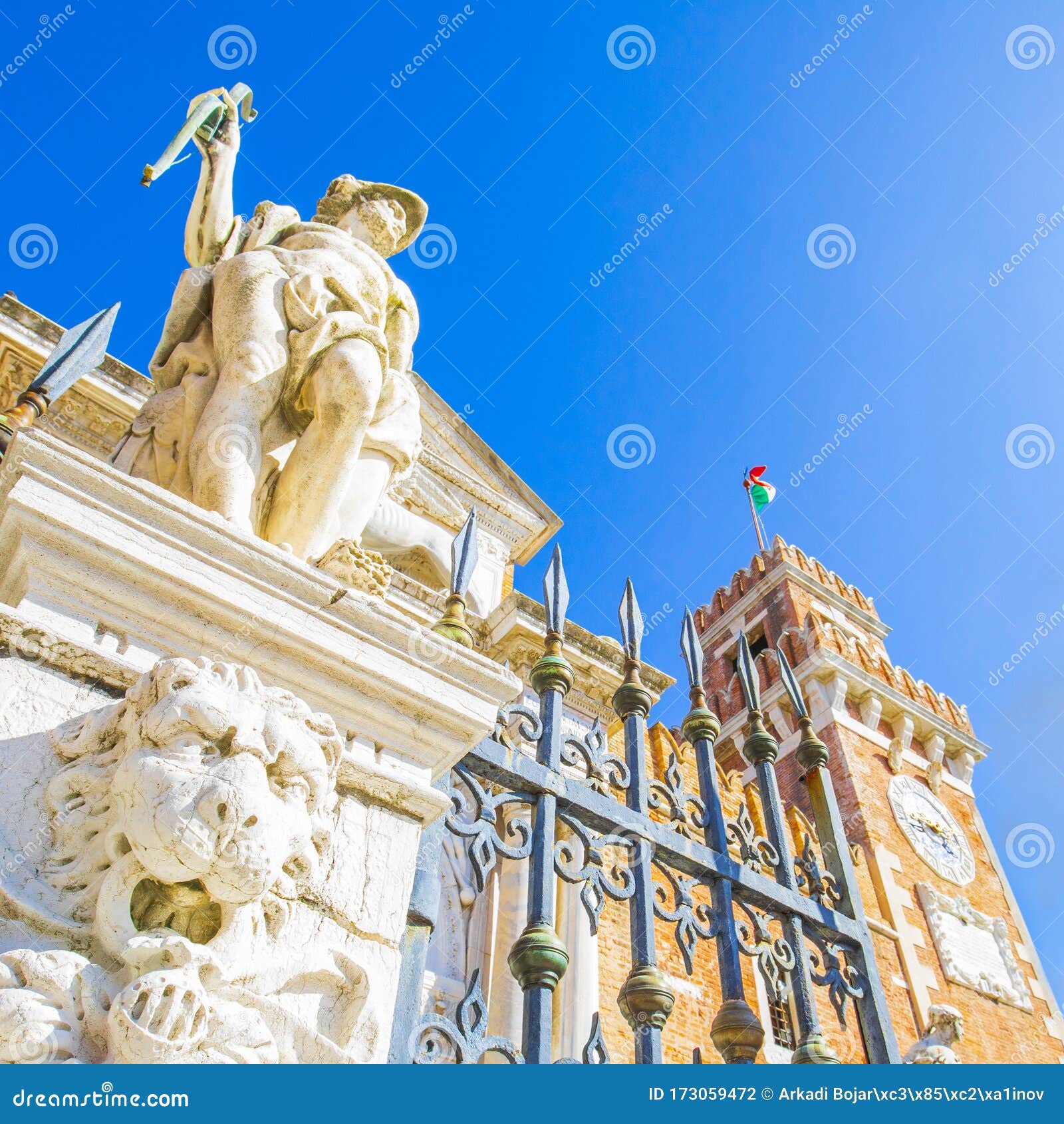 antique sculptures in front of arsenal harbor in venice