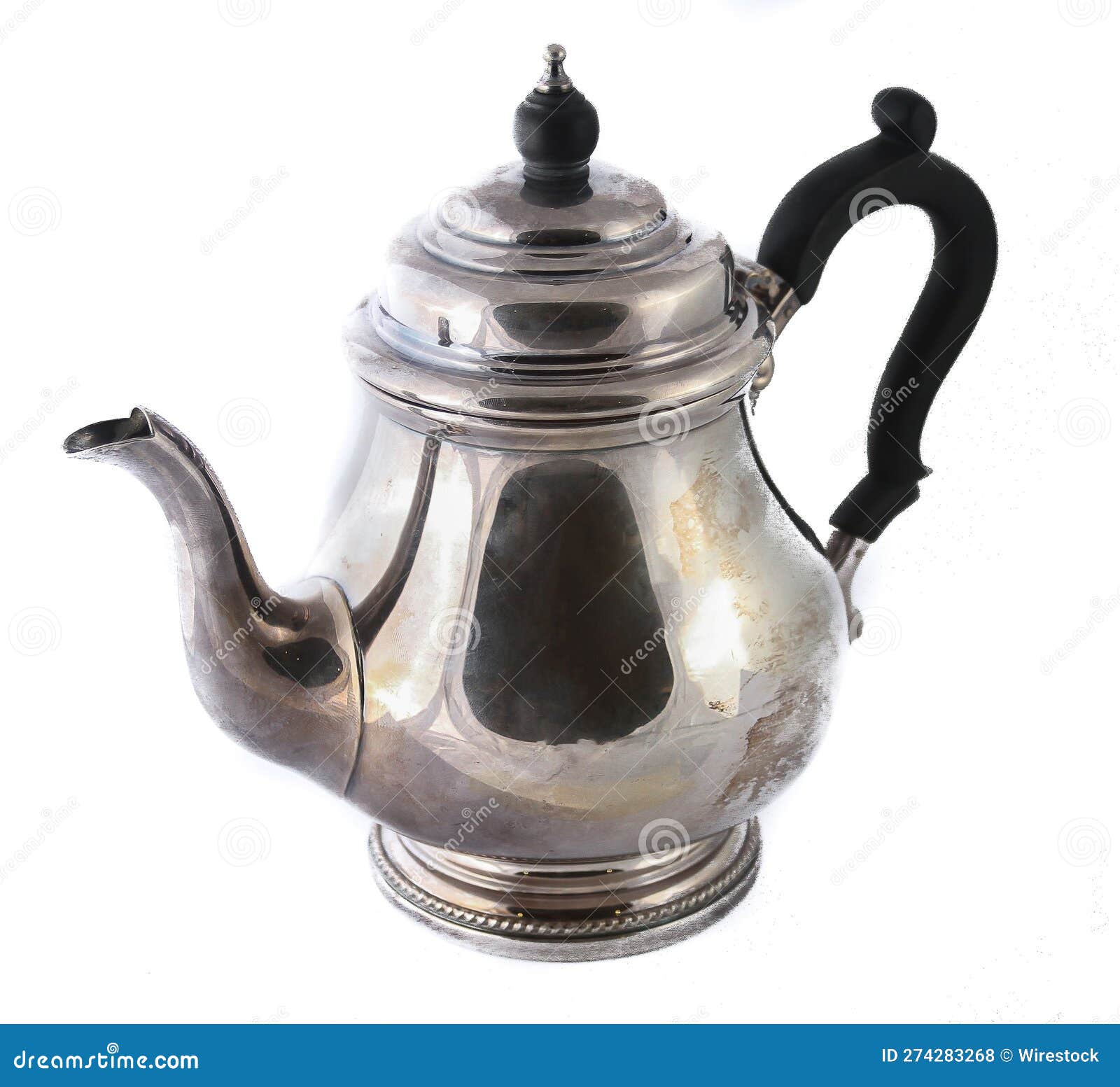 Antique Silver Teapot with a Curved Handle Isolated on a White