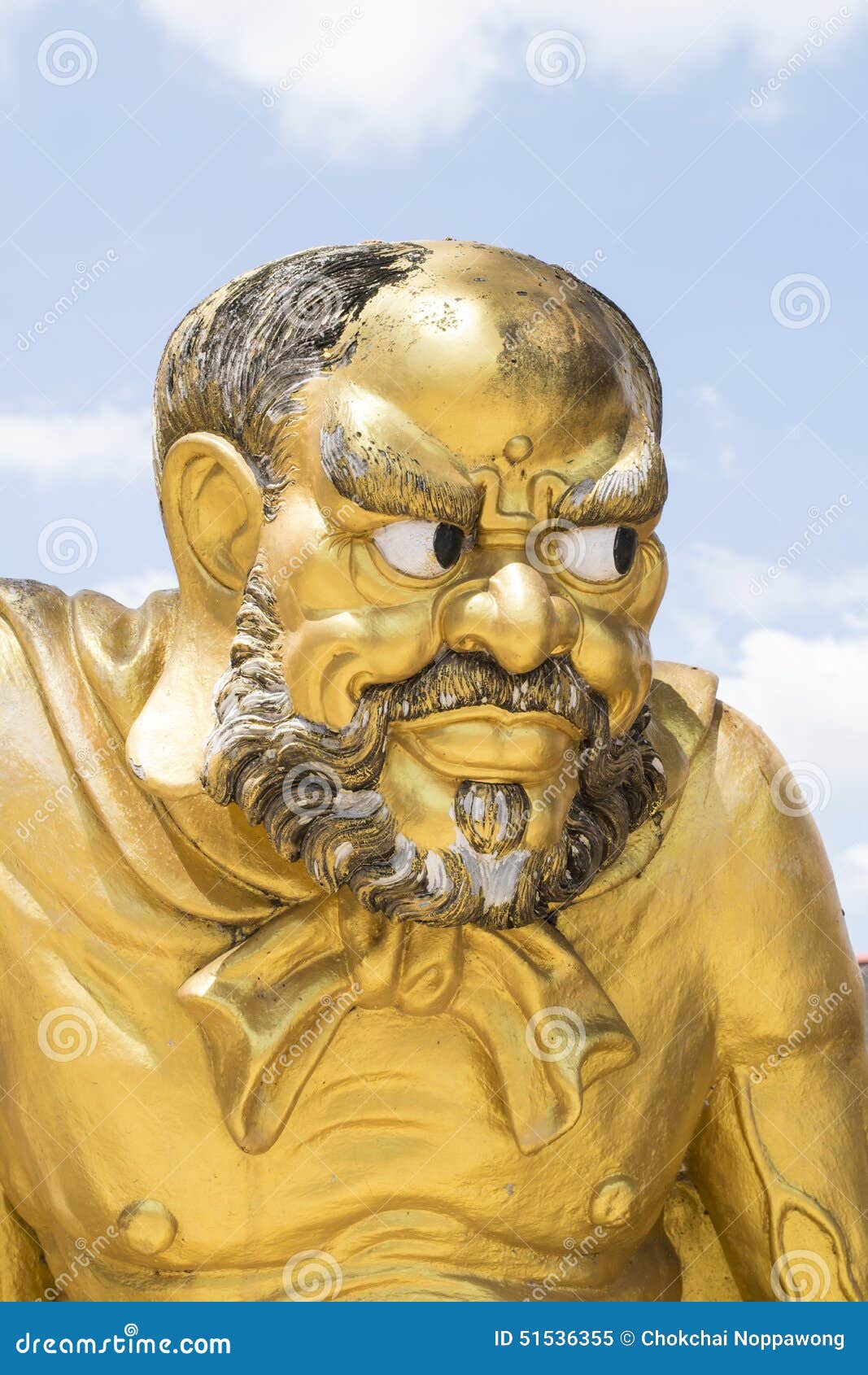 Antique Statue of a Chinese Monk Antique. Antique statue of a Chinese monk with blue sky