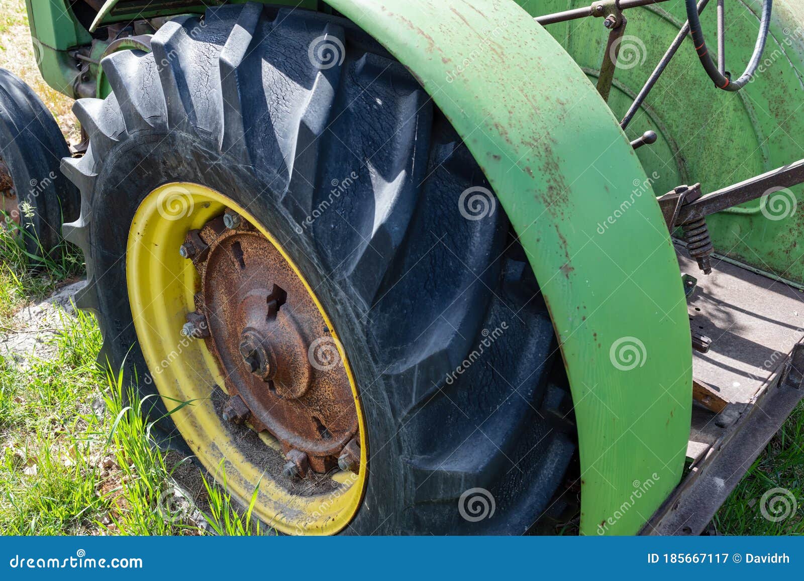 Antique tractor tire editorial photography. Image of industrial 185667117