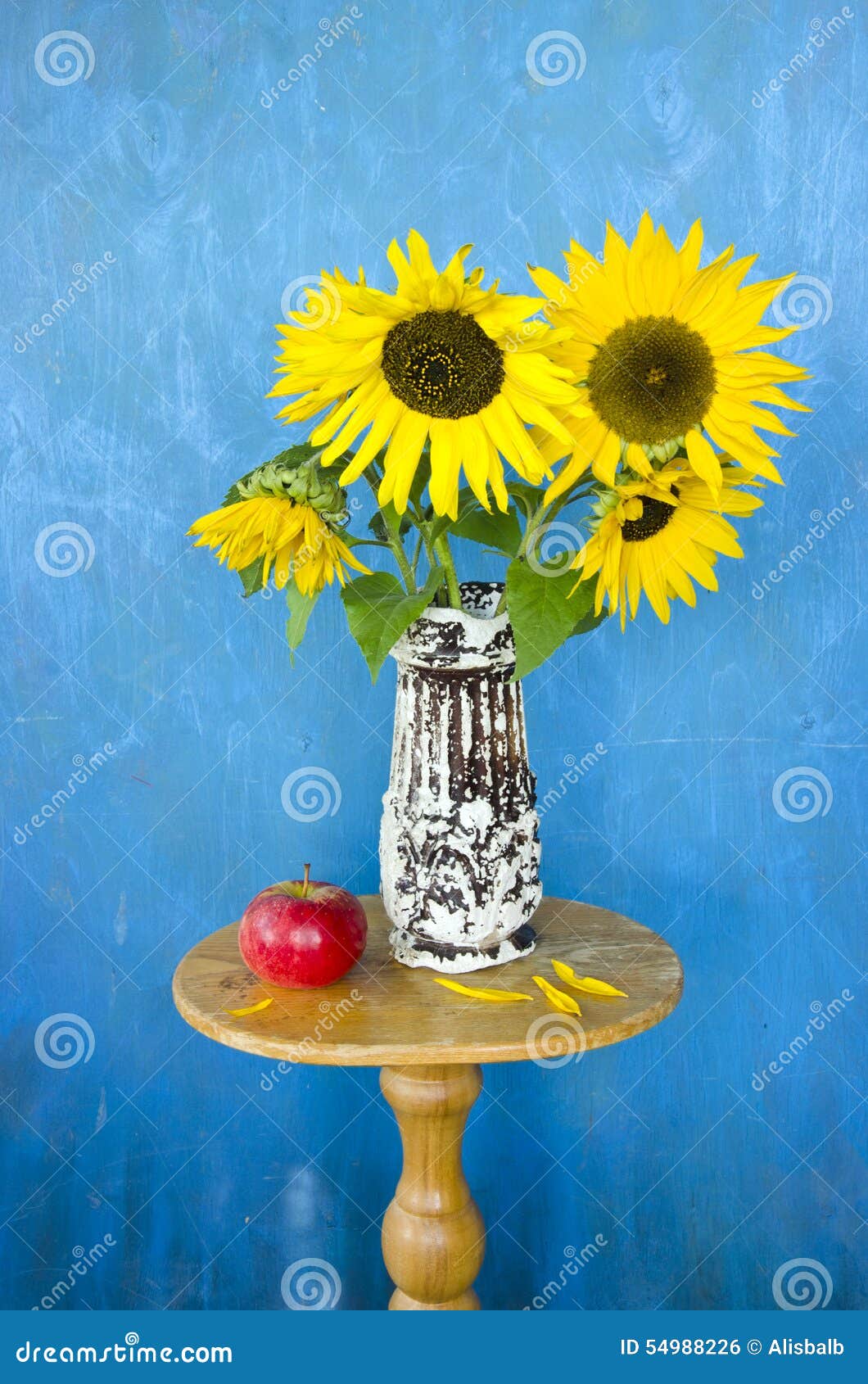 Antique Vase with Sunflowers and Red Apple on Table Stock Photo Image