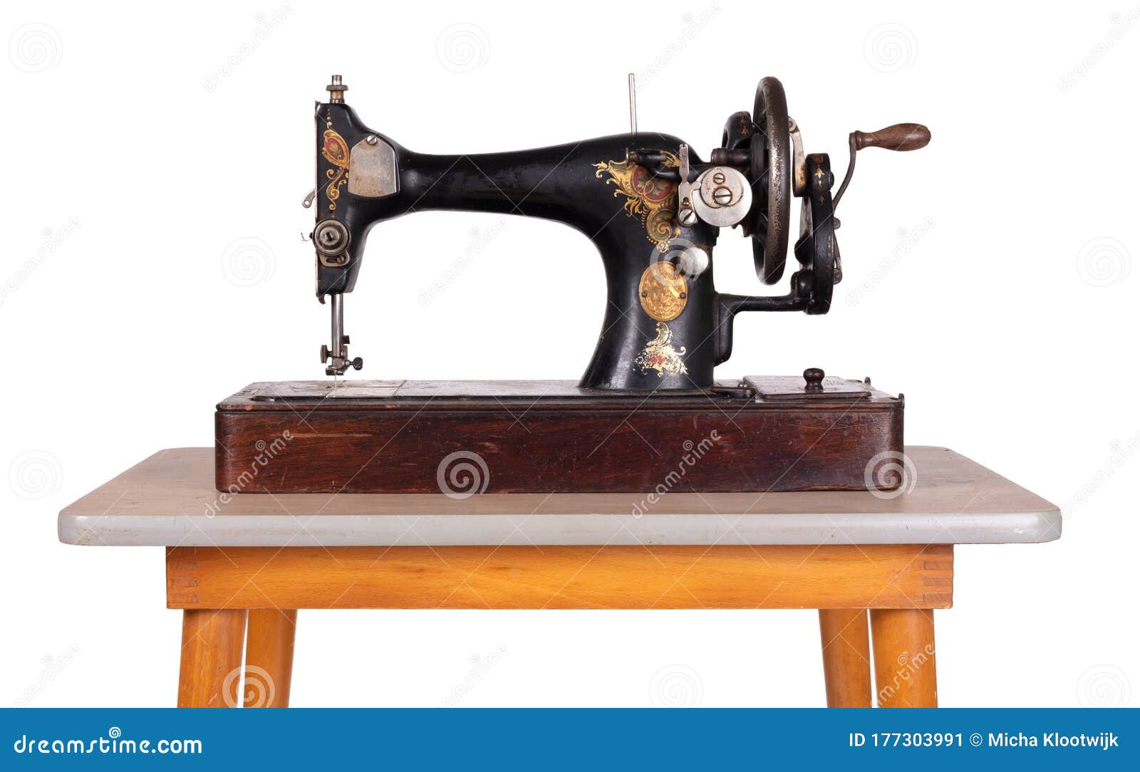Old sewing machine in table