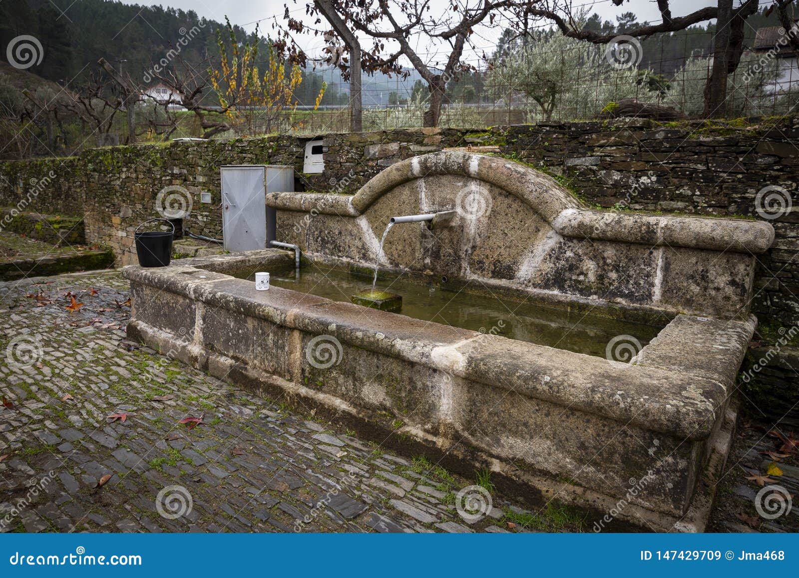 antique water fountain in barroca schist village
