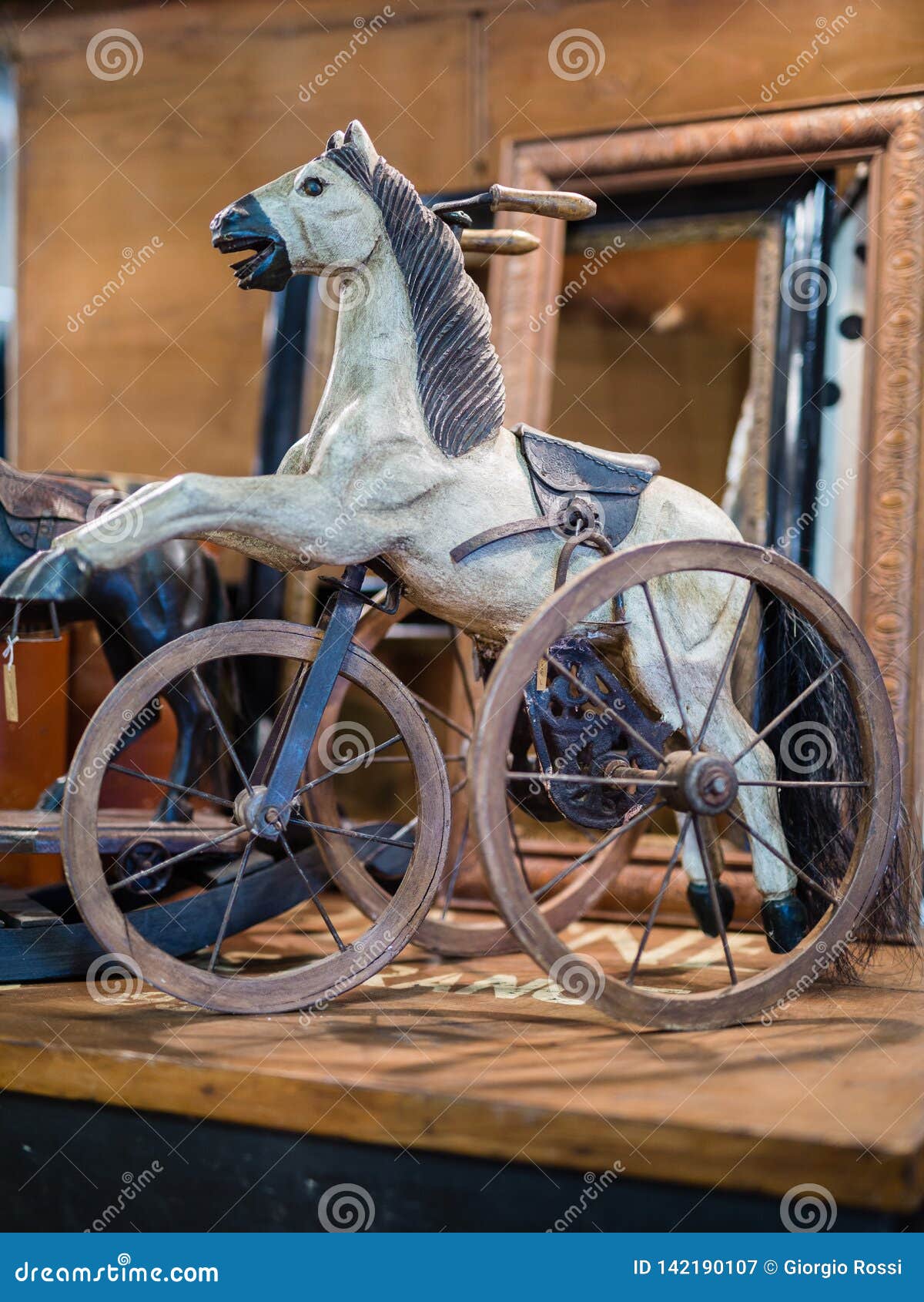 antique riding horse on wheels