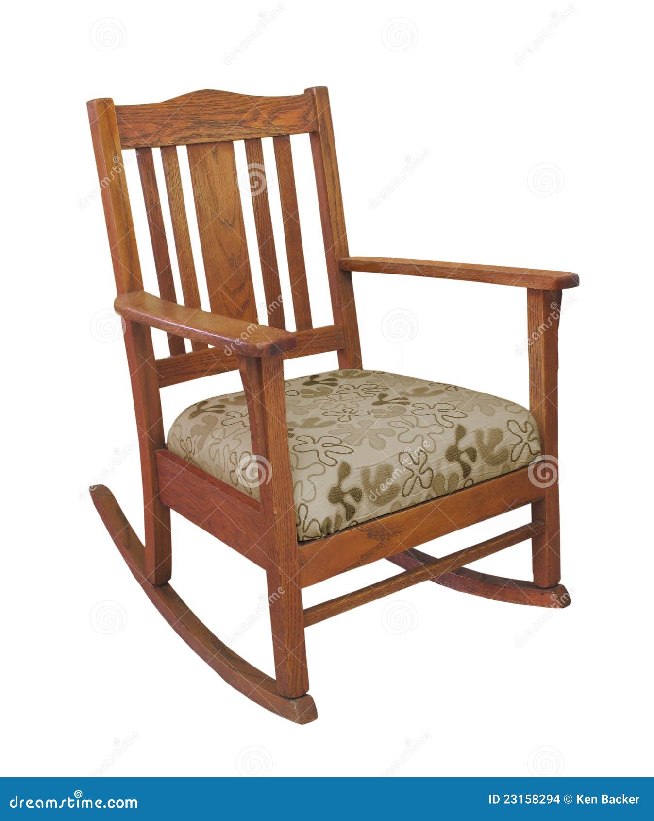 Antique oak mission style wooden rocking chair with cushion. Isolated 