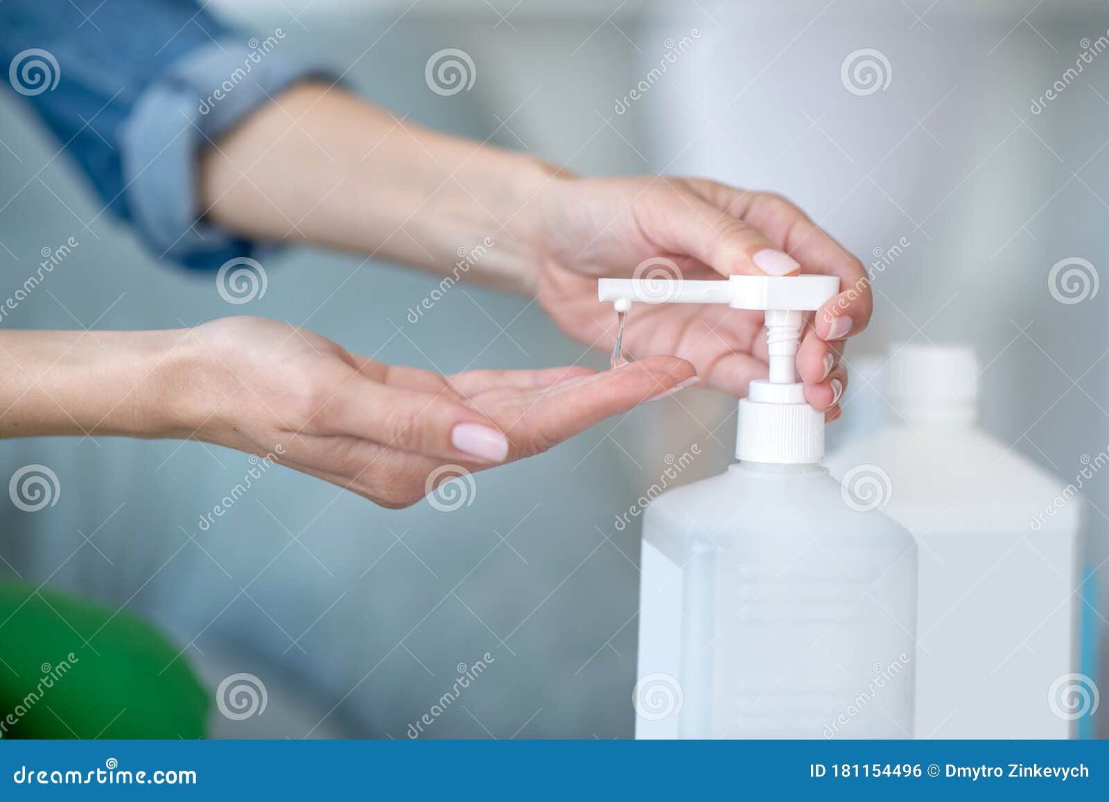 Close Up Picture of Human Hands Squeezing Antiseptic Stock Photo