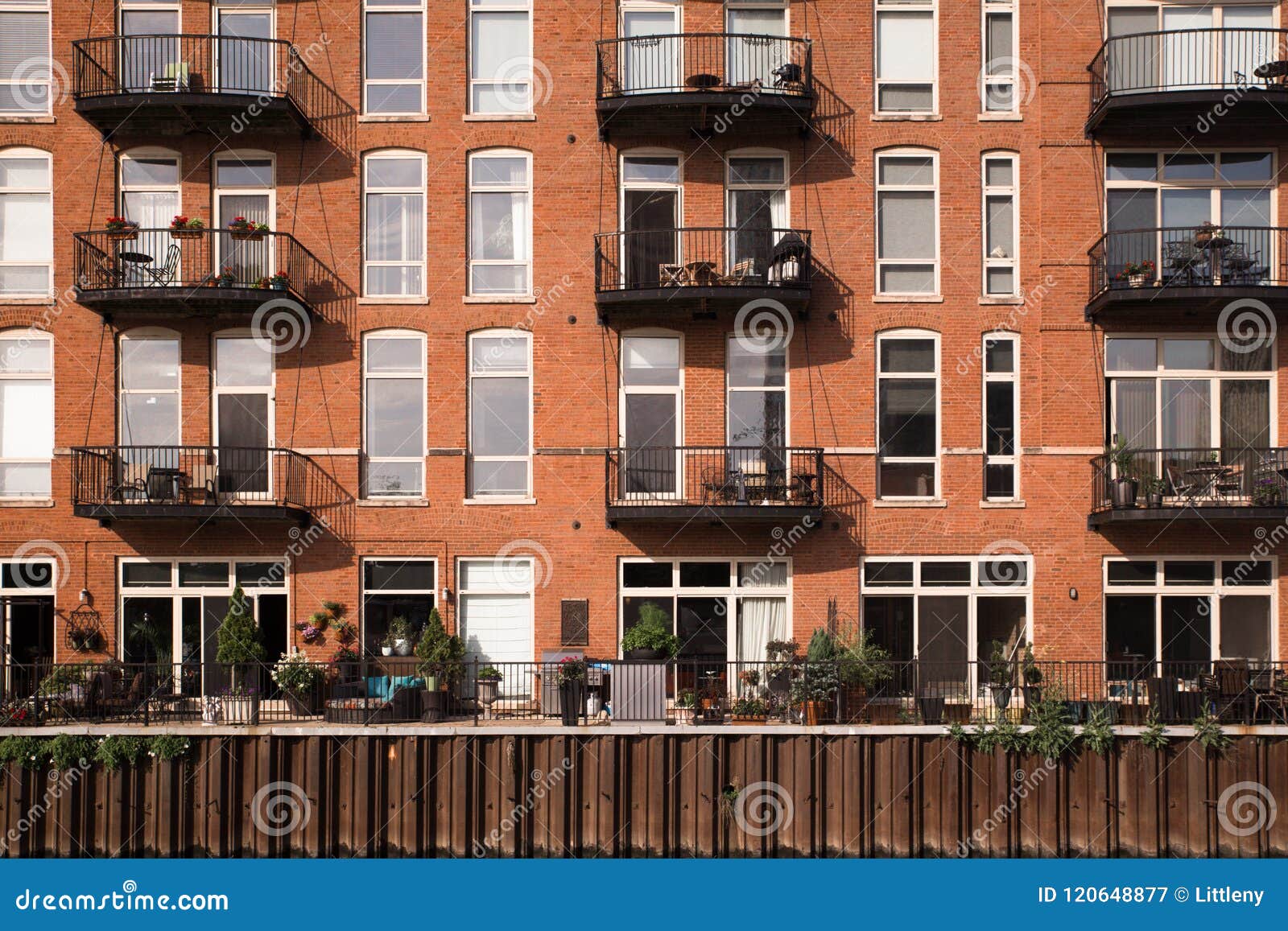 Apartment Building Facade with Balconies Stock Image - Image of flowers