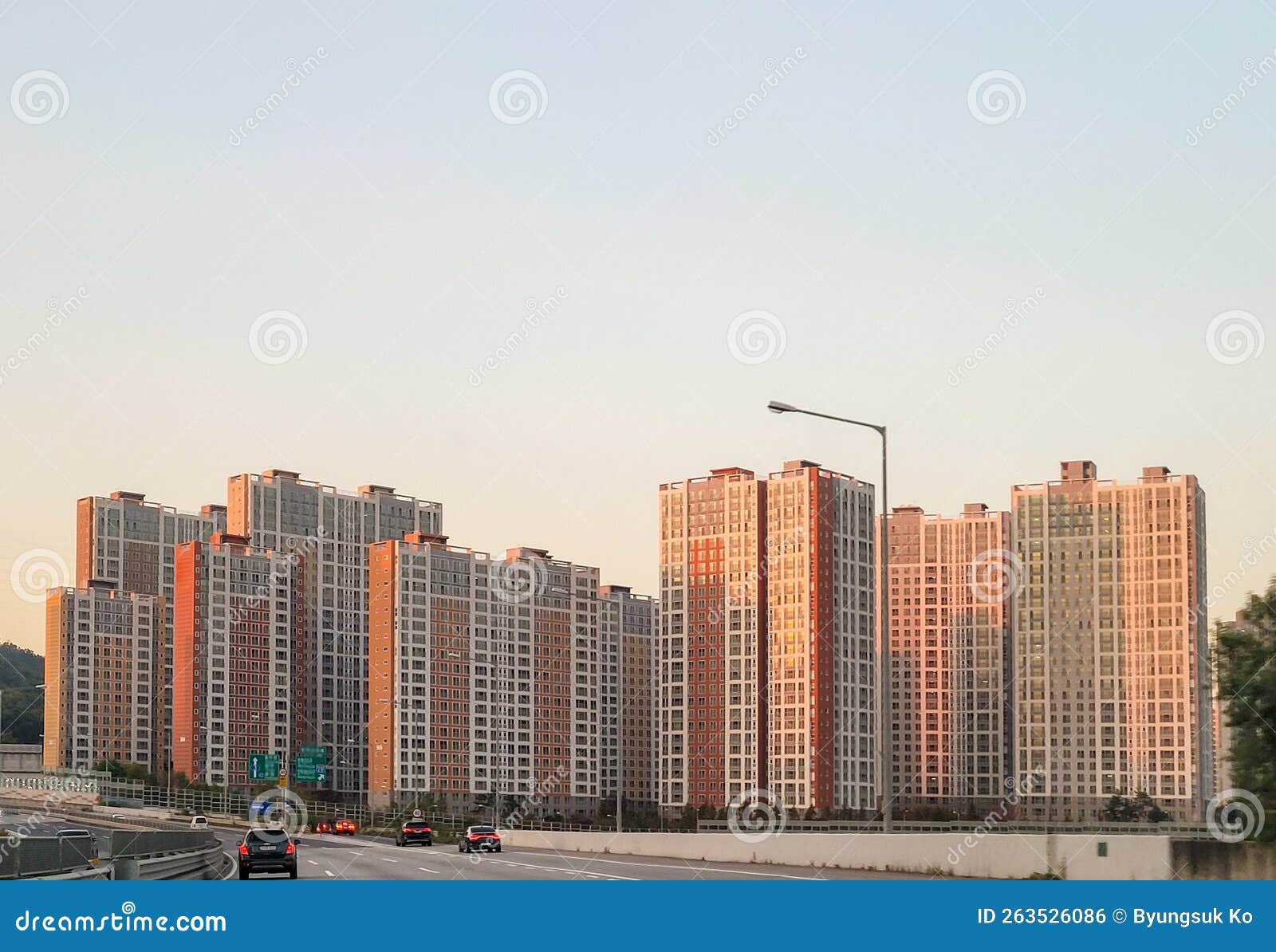 Apartment Complex by the Highway Under Sunset Stock Photo Image of