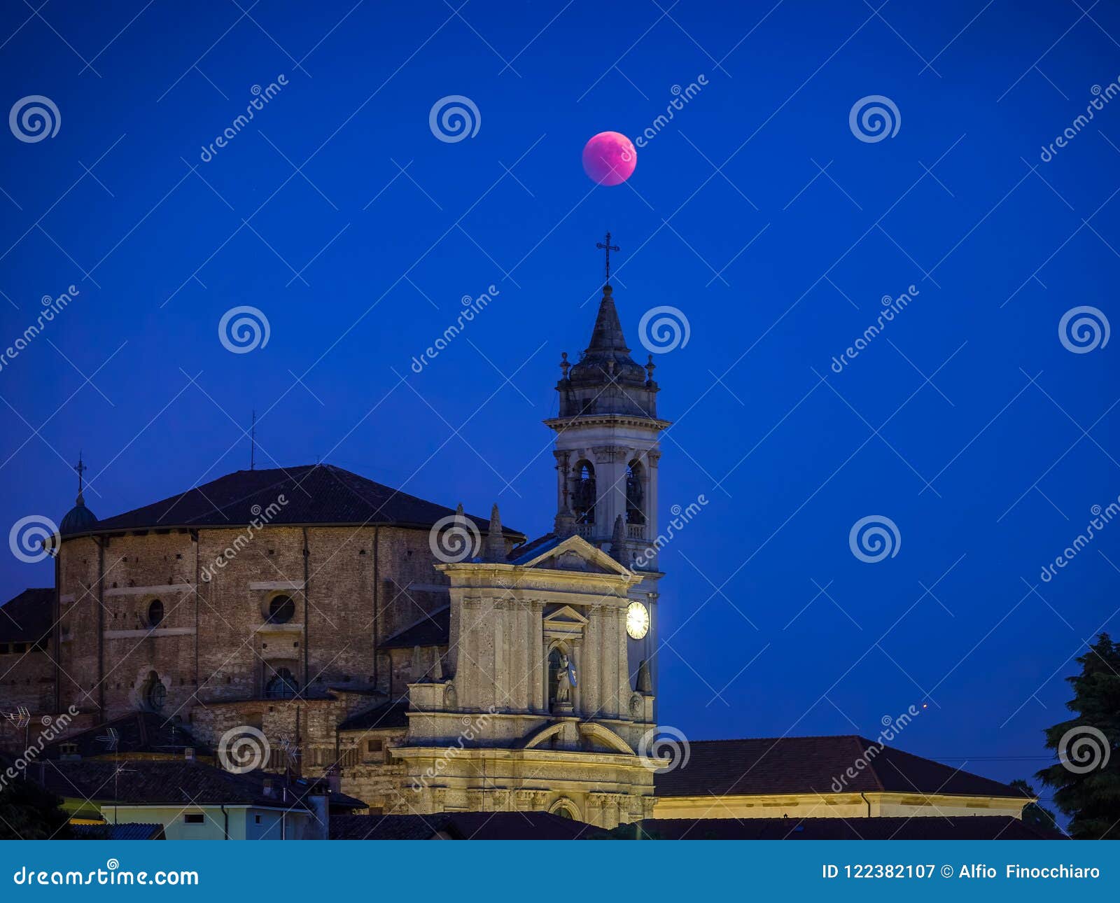 apocalyptic red moon eclipse over the church of trezzo sull`adda