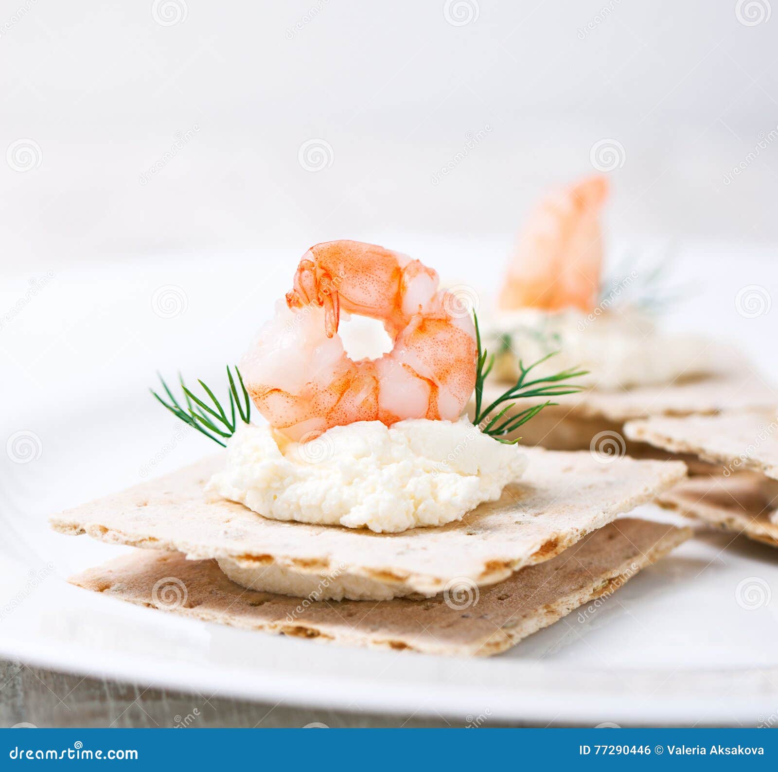 Appetizer Canape with Shrimp, Cheese and Dill on a Small Loaf of Bread