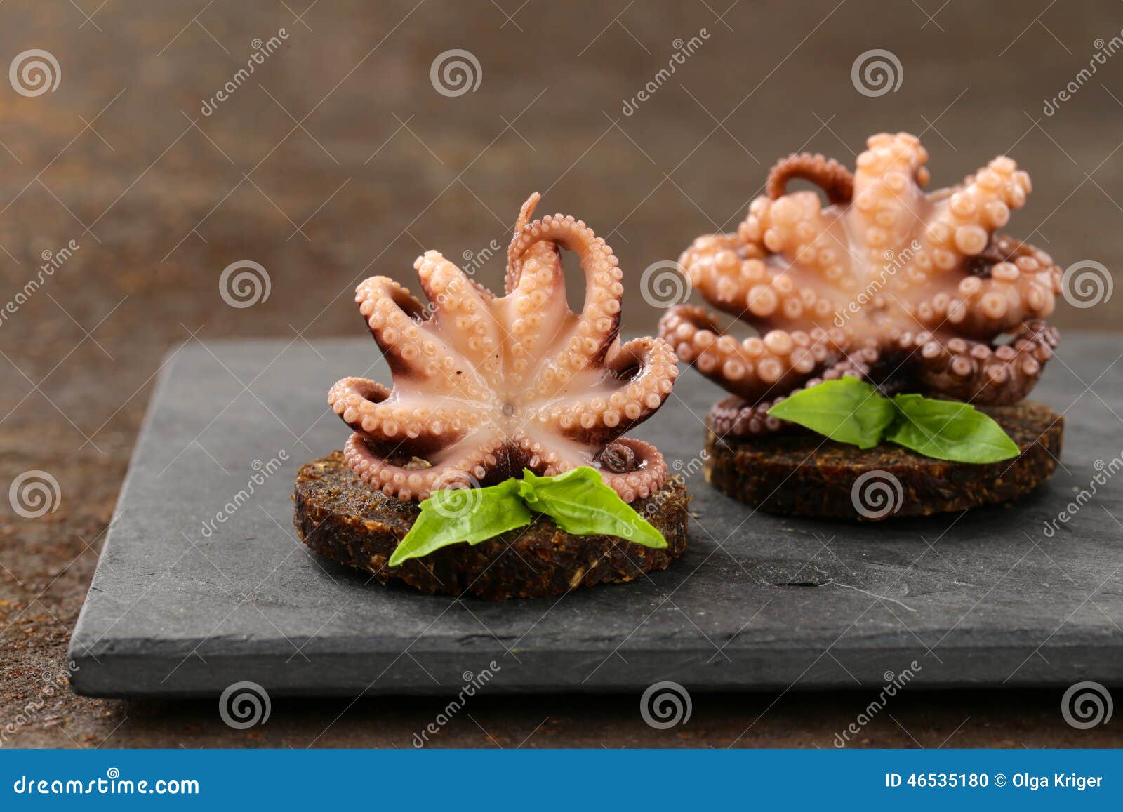 Appetizer Small Marinated Octopus (squid) with Basil Stock Photo