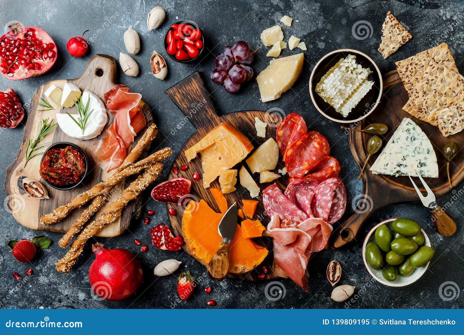 appetizers table with italian antipasti snacks. brushetta or authentic traditional spanish tapas set, cheese variety board