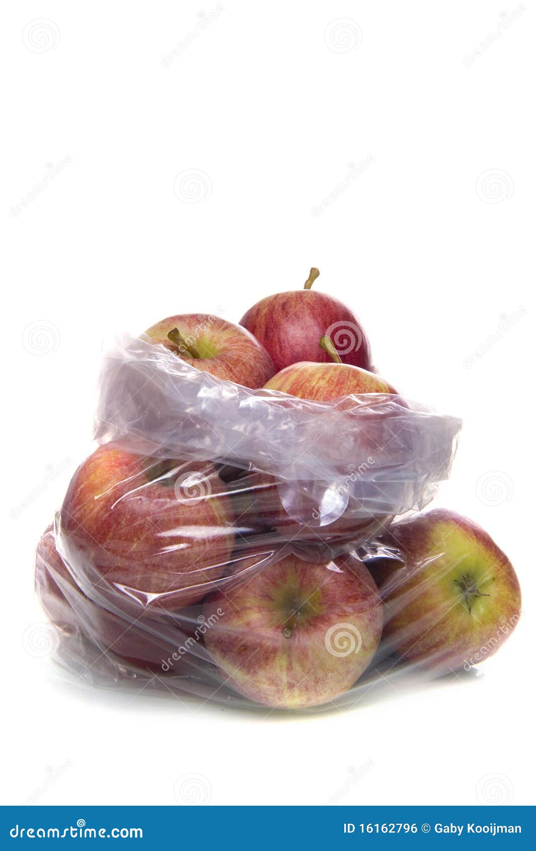 Apple fruit in plastic bag on wood table Stock Photo by ©jannystockphoto  77413662