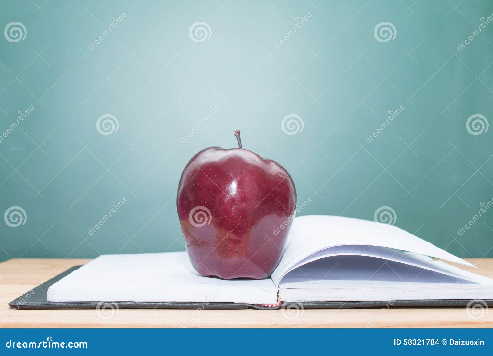 Apple on books stock photo. Image of books, education - 58321784