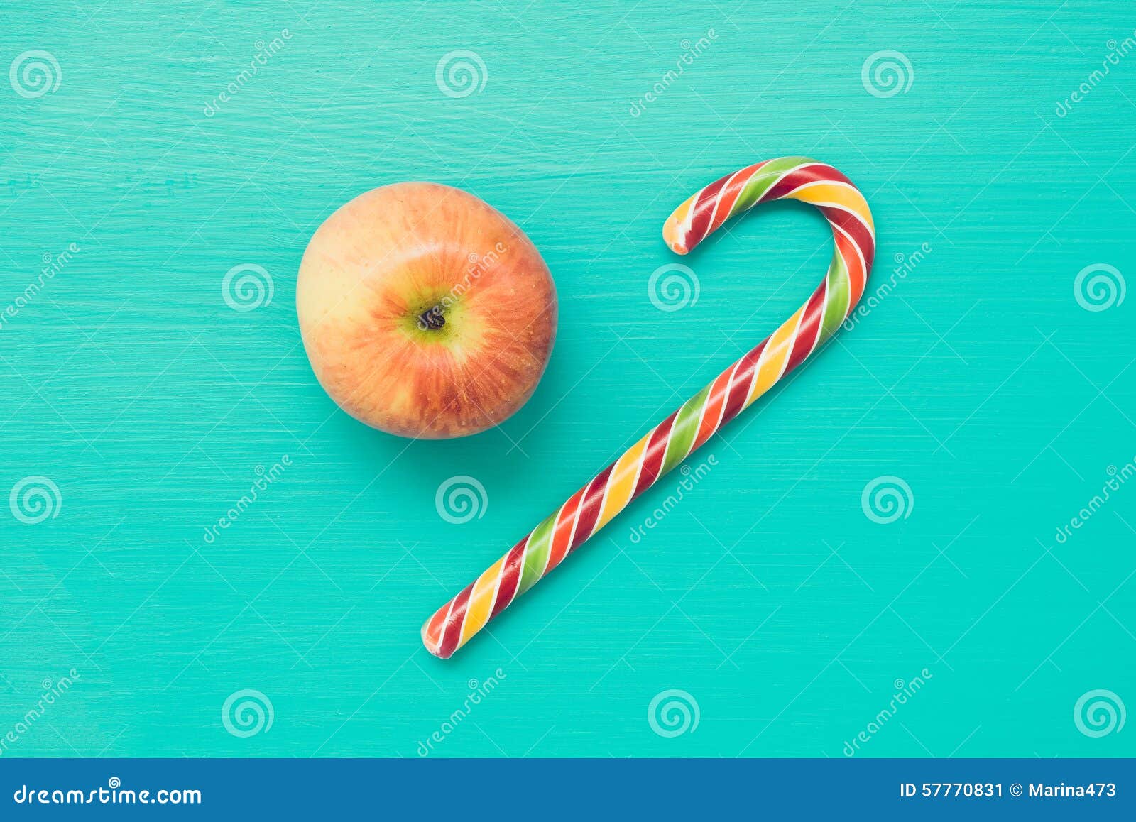 Apple and candy cane stock image. Image of candy, fruit 57770831
