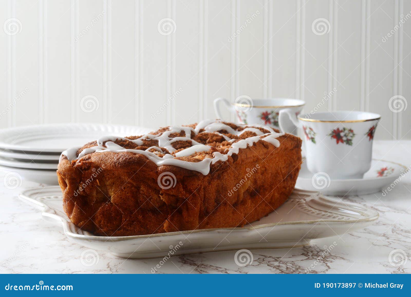 apple fritter loaf cake with icing sugar