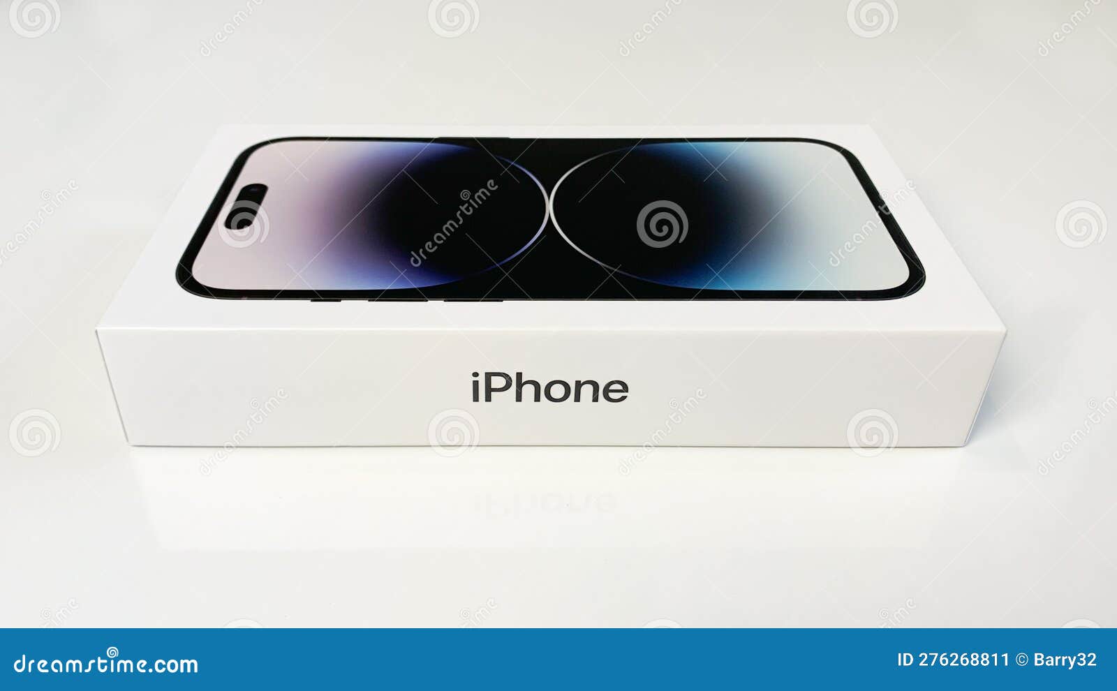 Apple IPhone 14 Pro in Box on White Table, Side View Apple IPhone 14 Pro in Box on White Table, Side View