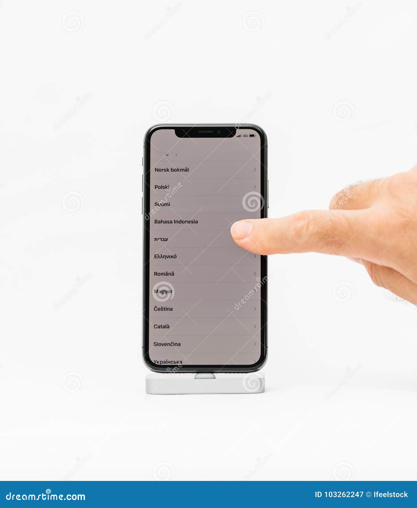 Apple iPhone X smartphone isolated white background language , s. PARIS, FRANCE - NOV 5, 2017: New Apple iPhone X 10 smartphone isolated white background hand scroll to select the language of the phone