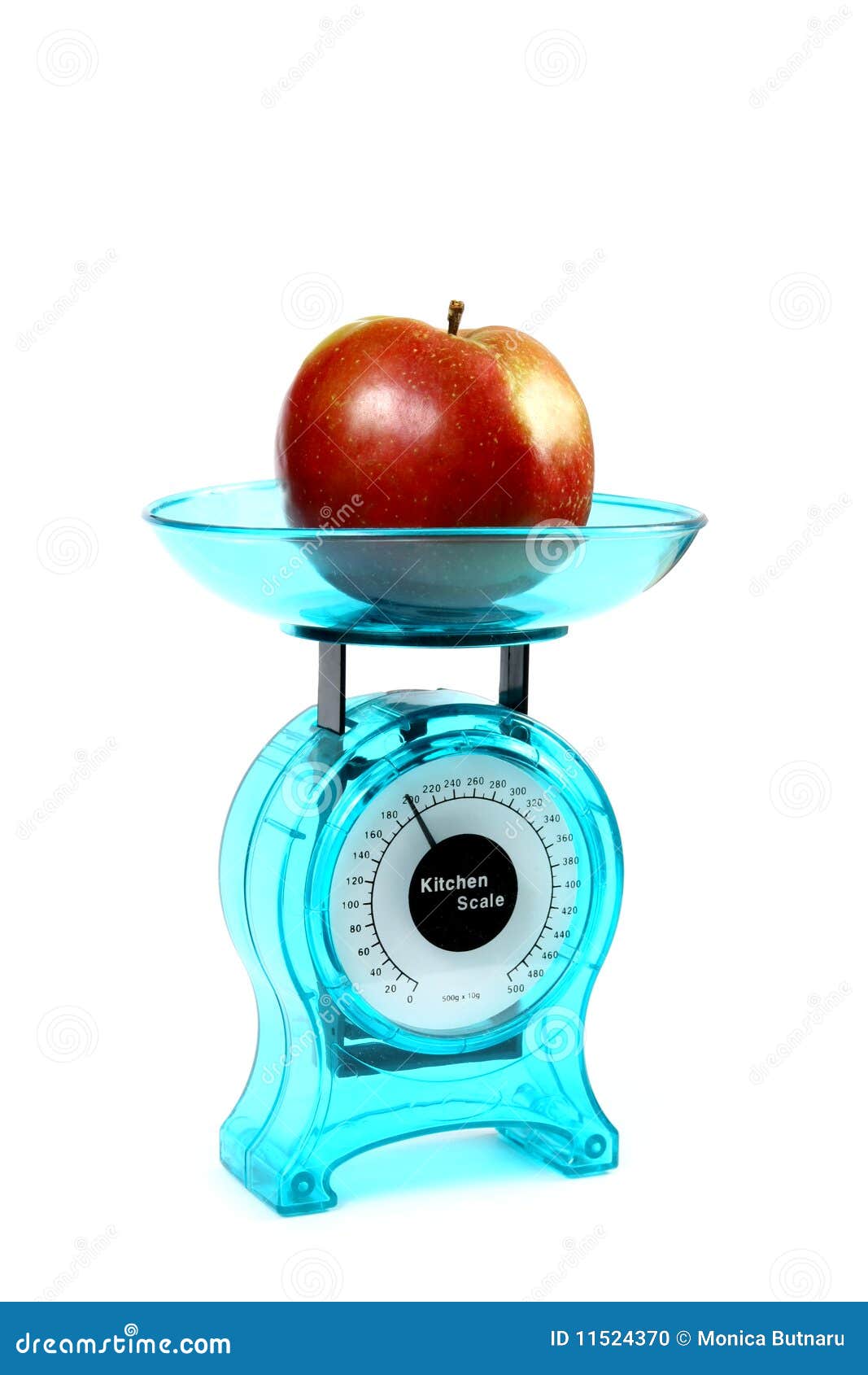 Apple on a kitchen scale stock photo. Image of balance 11524370
