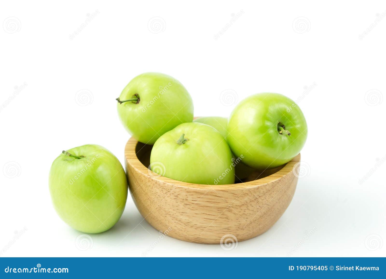 apple monkey or jujub zizyphus mauritiana lam  green fruit in wooden cup on white background and clipping path