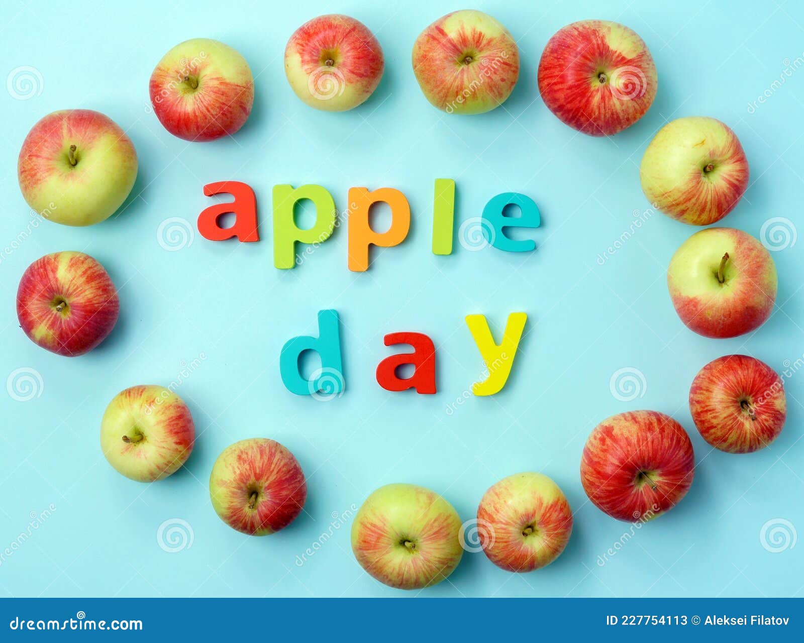 Apple is a National Holiday on October 21. Red Apples on a Blue