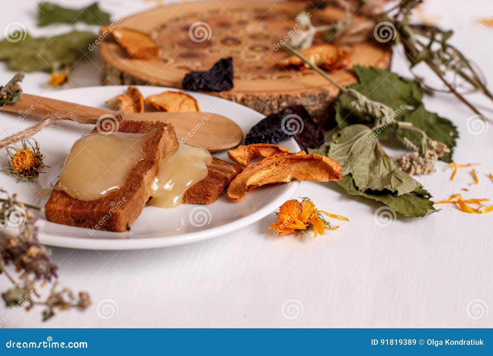 apple pastillas, honey, dried fruit on a white table