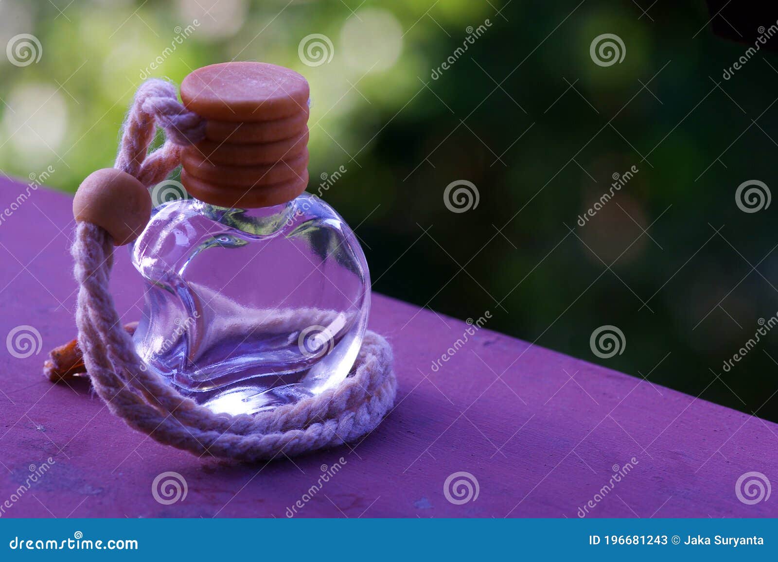 perfume in purple apple shaped bottle