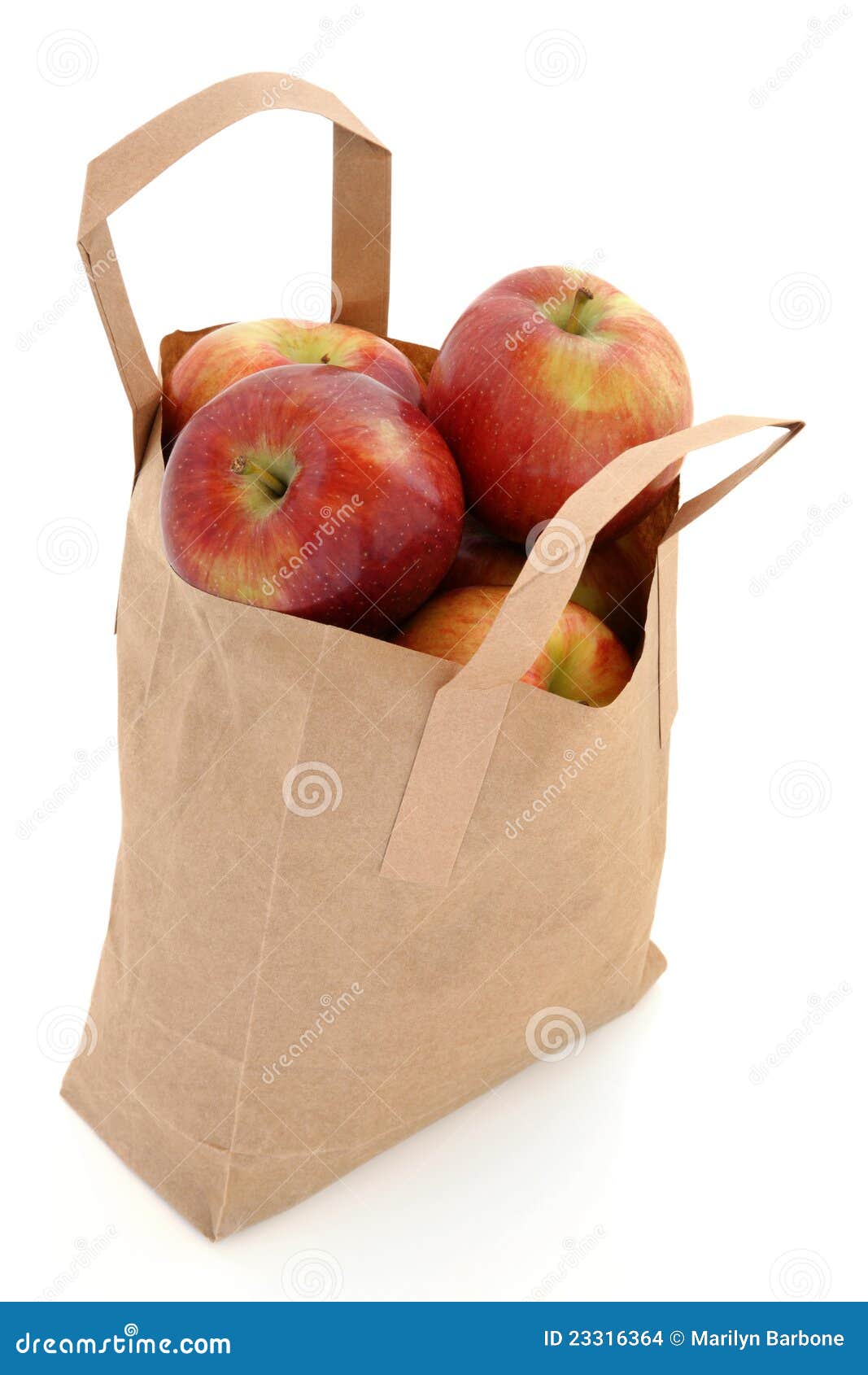 Plastic bag of red apples stock photo