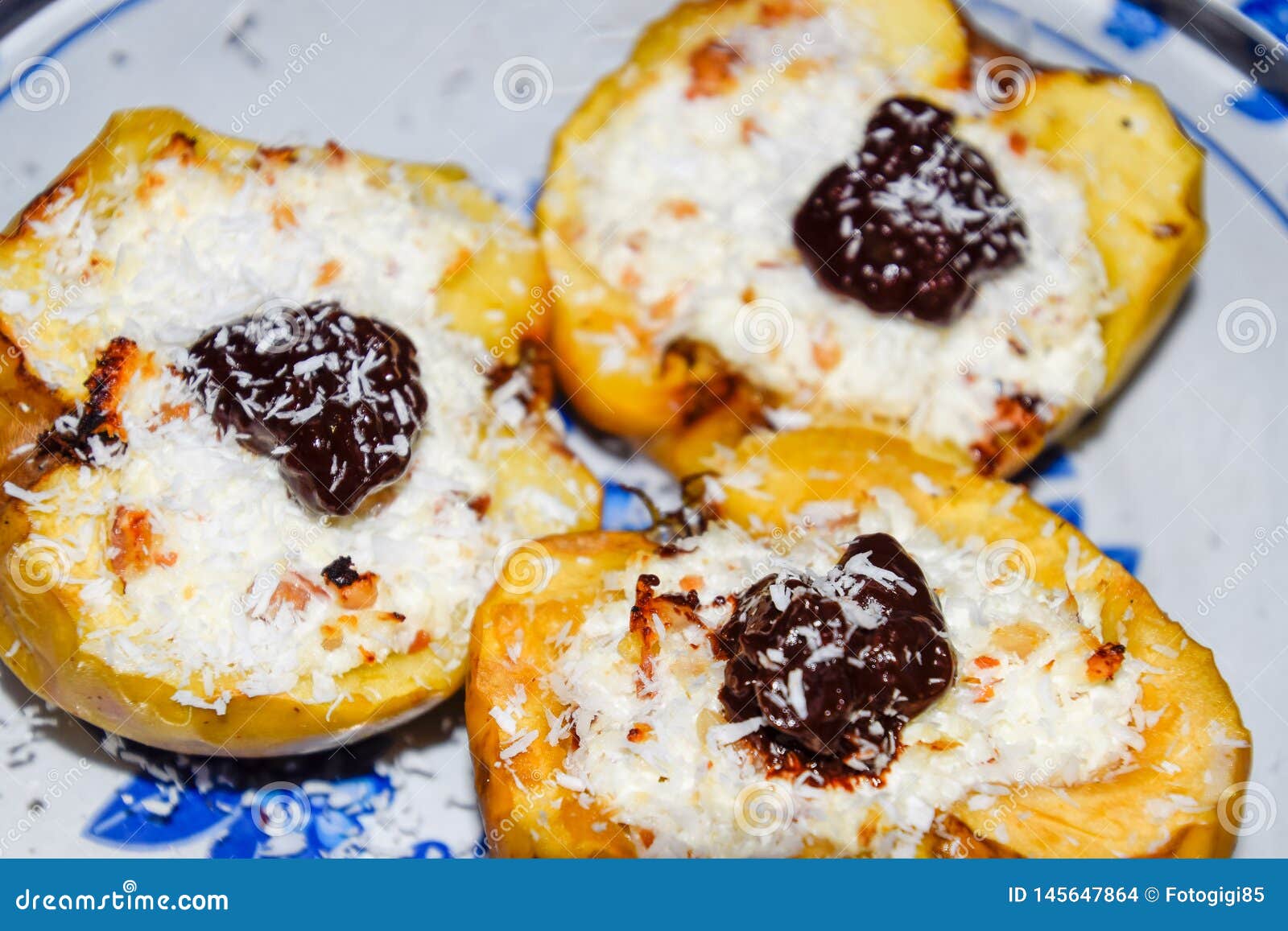 Apples Baked with Cottage Cheese and Decorated with Chocolate and Coconut Chips Stock Photo