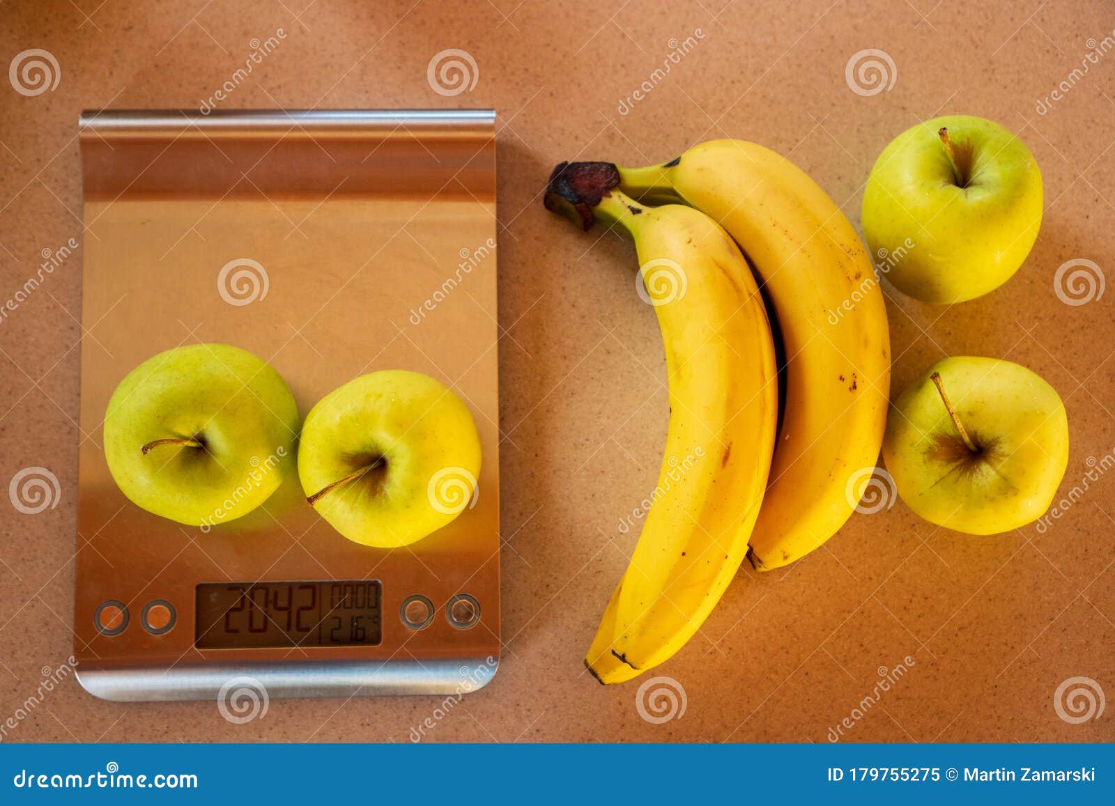 Two apples on a digital kitchen scale - Stock Image - H305/0140 - Science  Photo Library