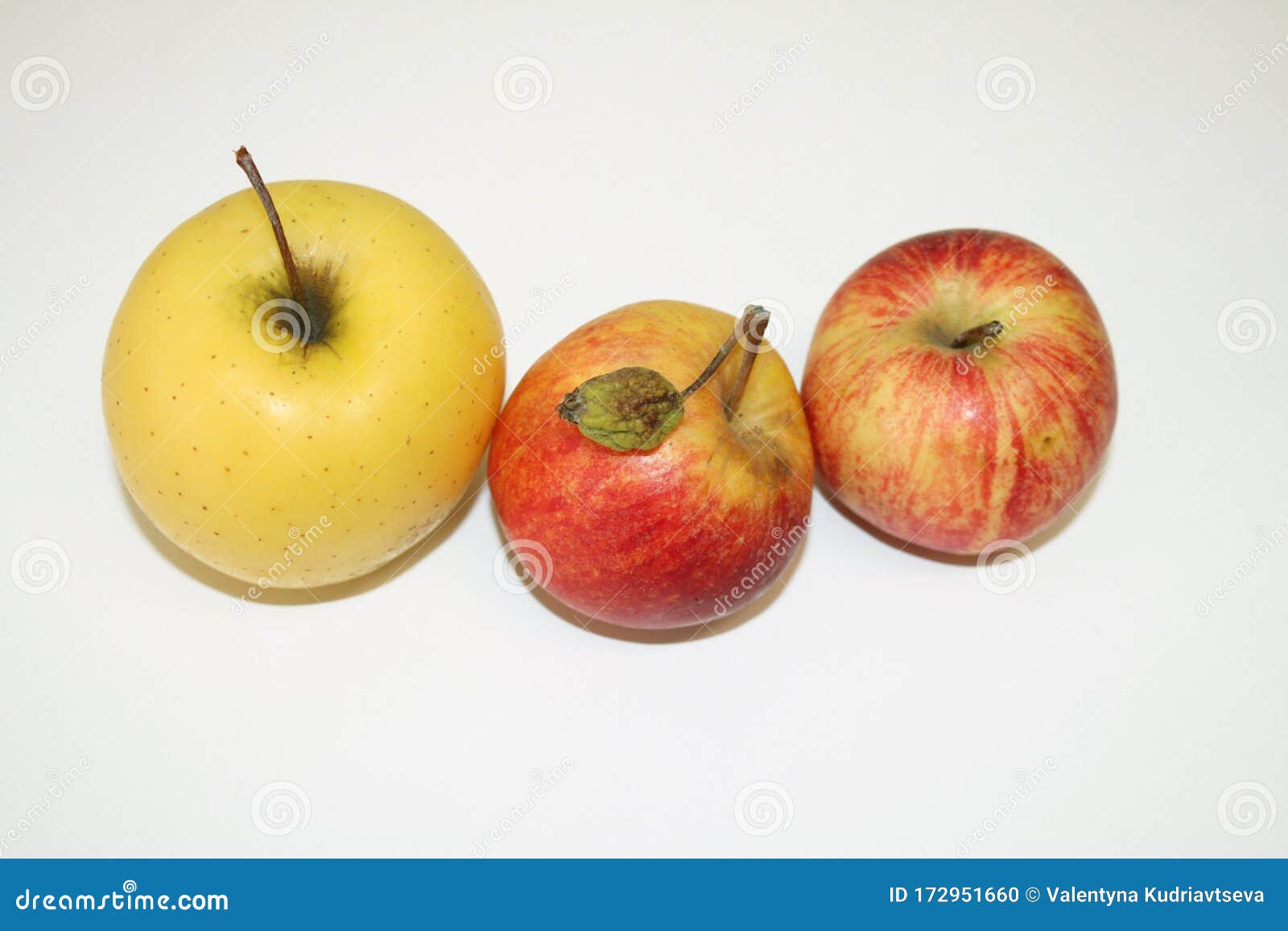 apples red and yellow on white background