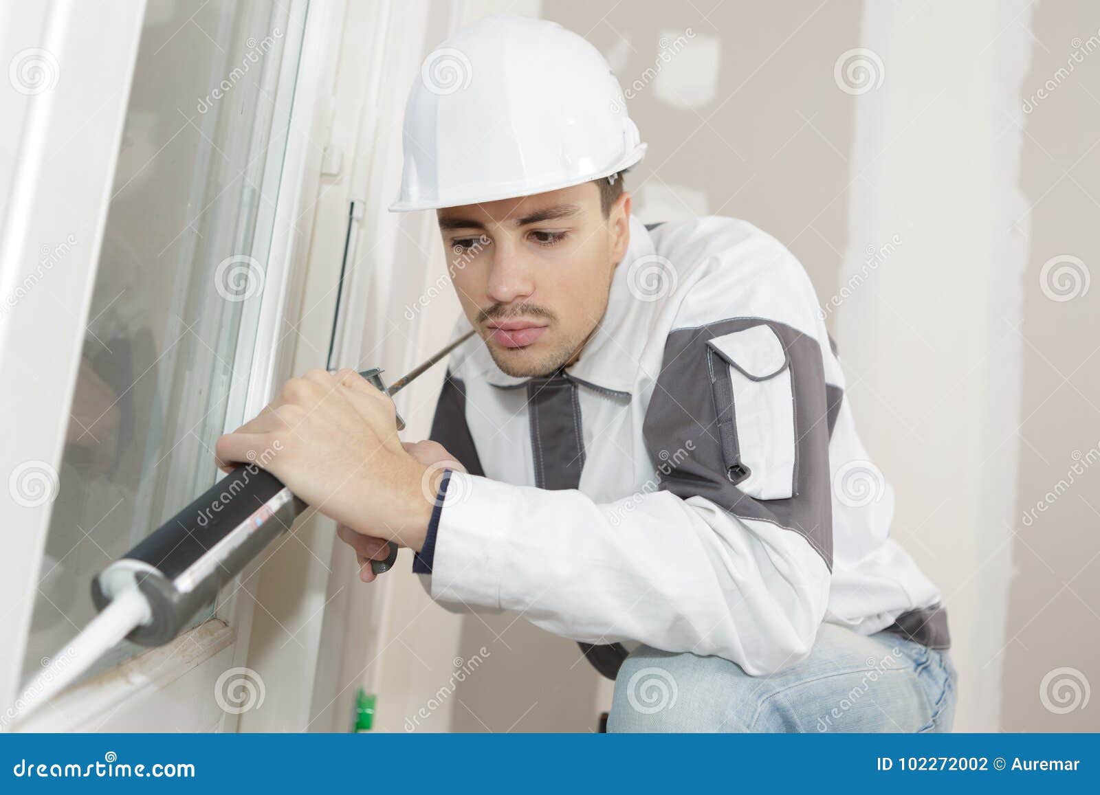 Applying caulking on gaps stock photo. Image of instrument 102272002