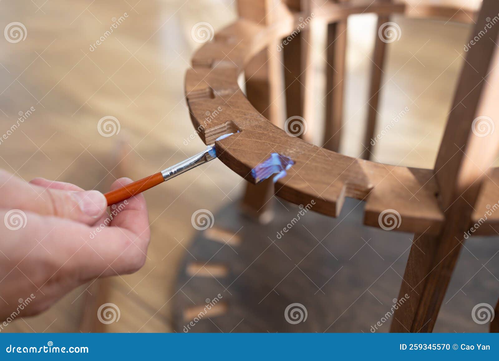 Applying Glue on the Wood. Carpenter at Work Using Glue in His