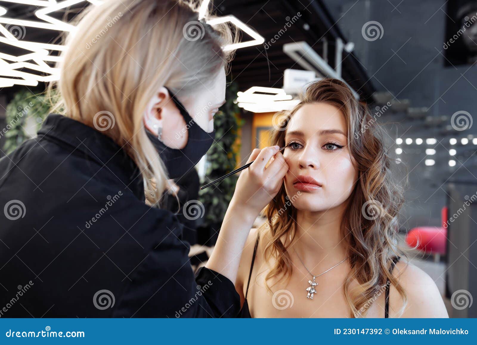 Applying Makeup on the Eyebrows in a Beauty Salon. Stock Photo Image