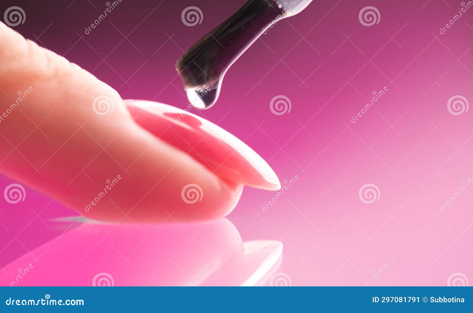 applying nail polish, pink shellac uv gel, varnish, manicure process concept in beauty salon