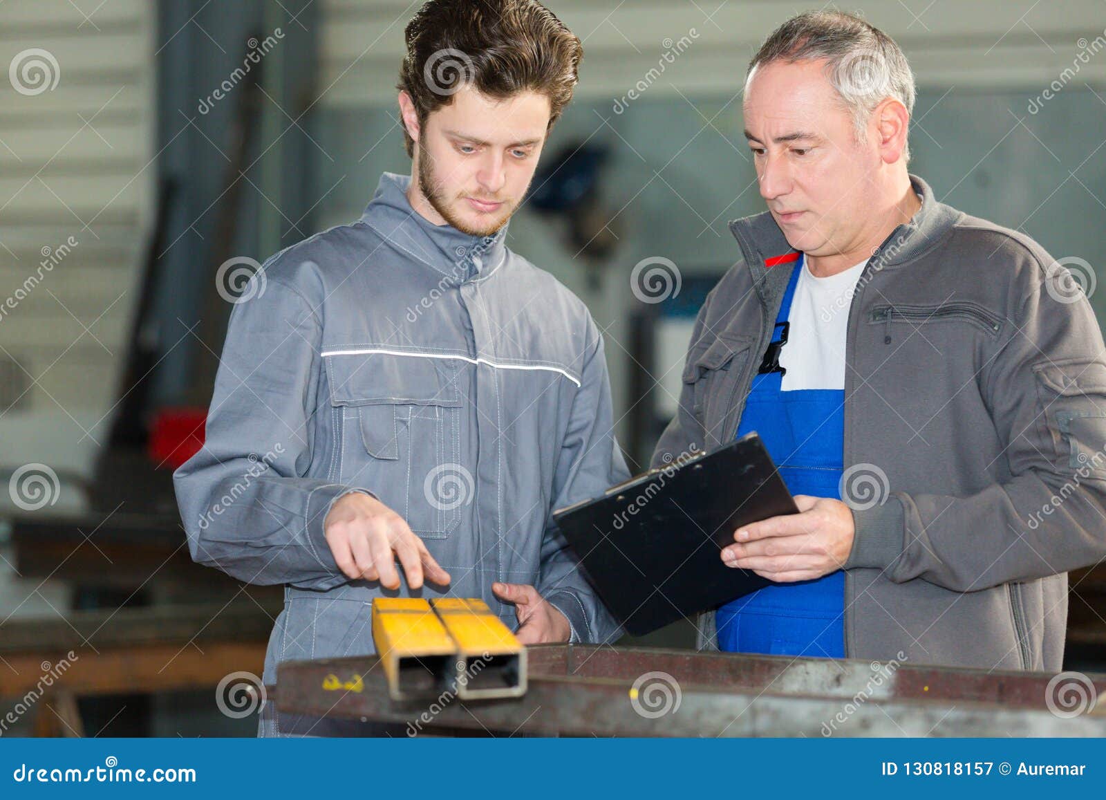 apprentice-being-shown-how-to-cut-sheet-metal-stock-image-image-of-control-industrial-130818157