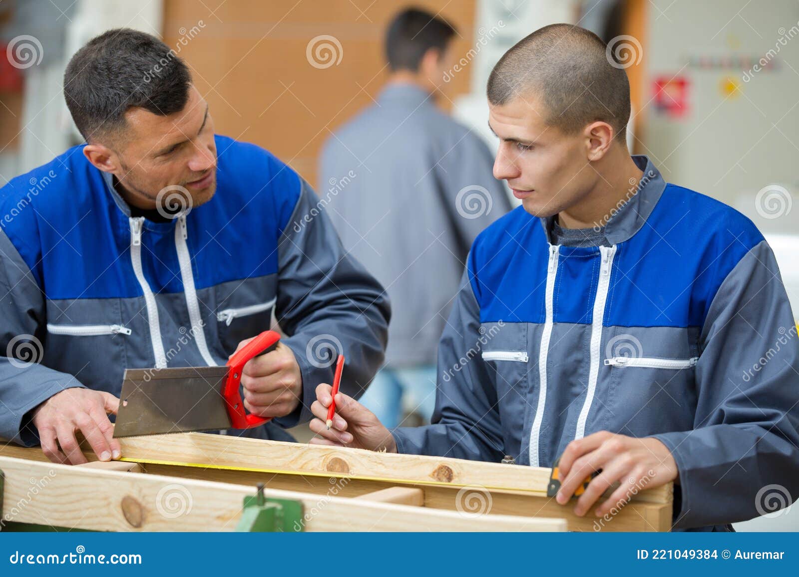 Apprentice Carpenter Marking Wood Foreman Holds Hacksaw Stock Photo