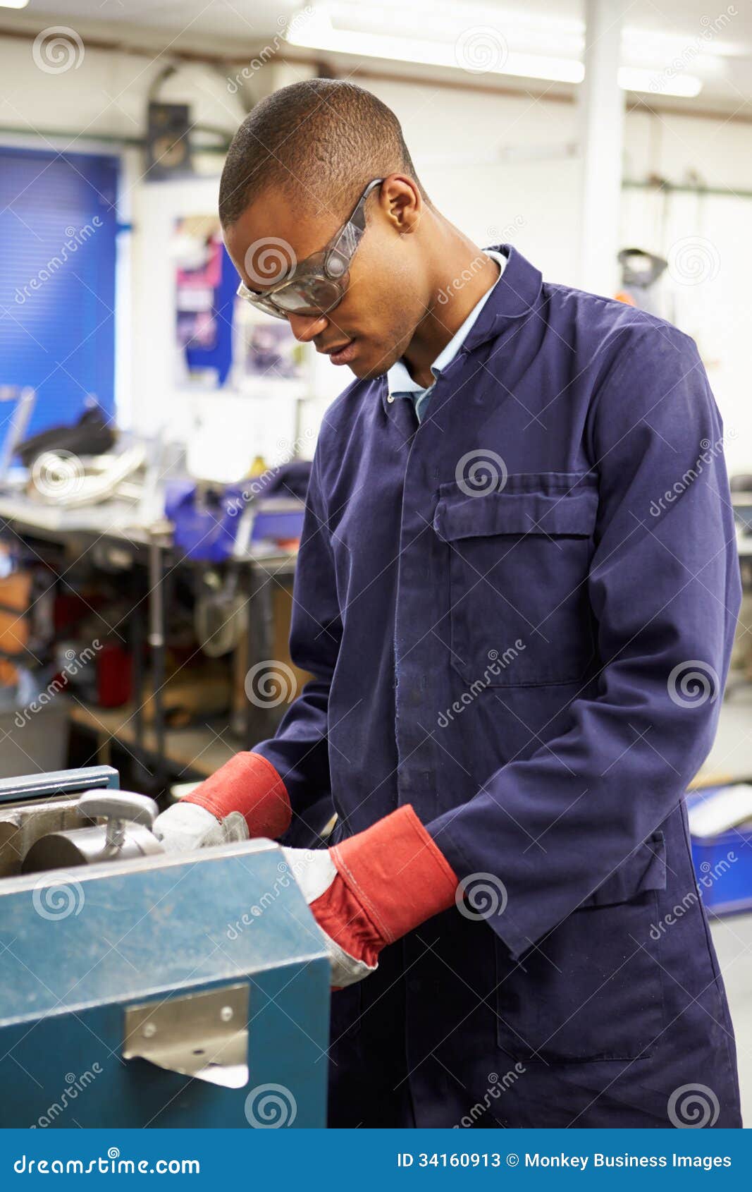 apprentice engineer working on factory floor