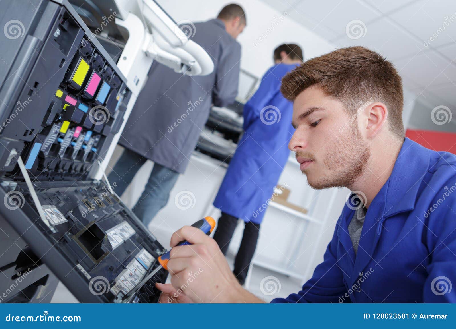 Apprentice Fixing a Printer Stock Image Image of documents, office