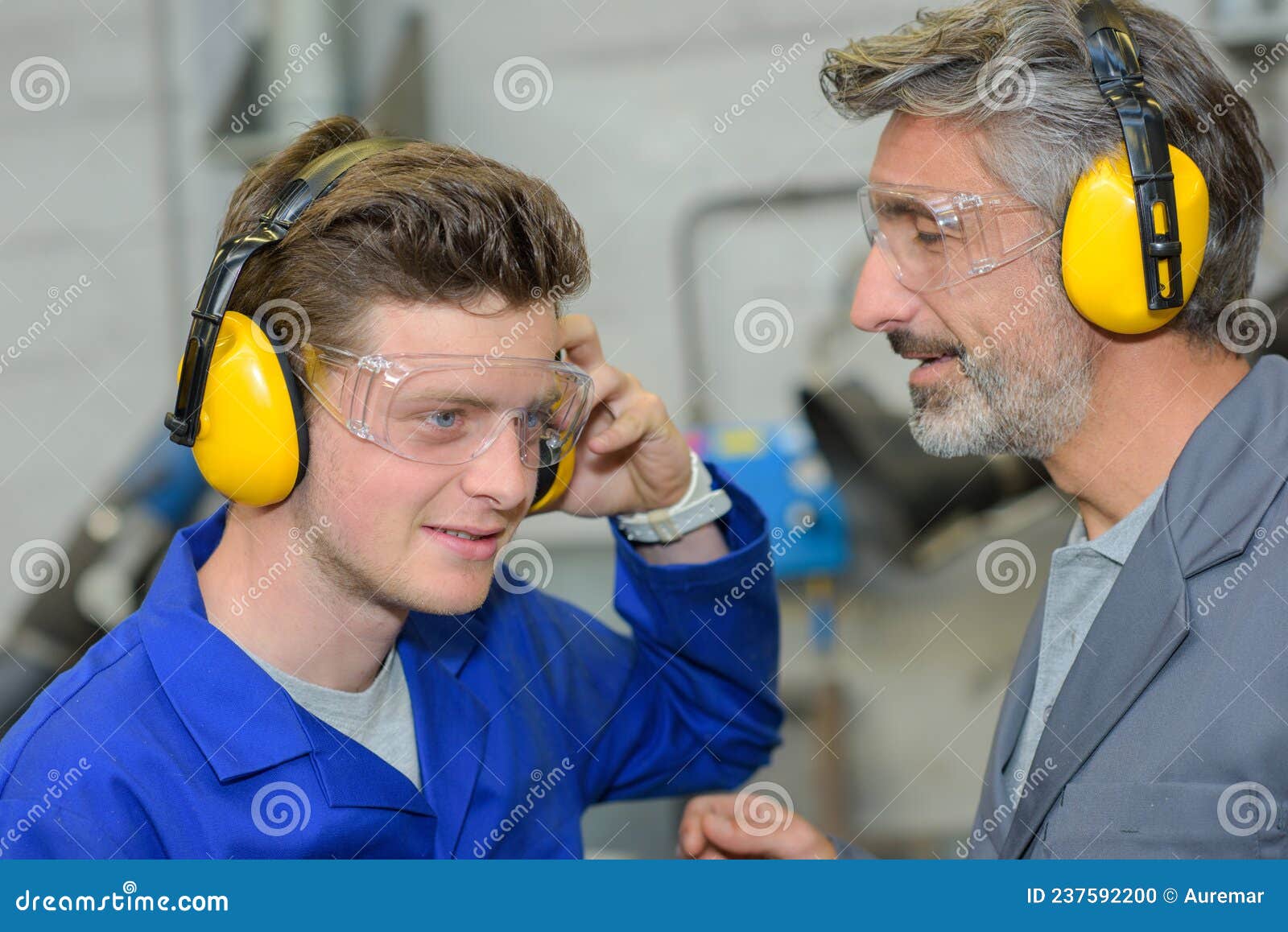 Apprentice Testing Earmuffs Stock Photo Image of earmuffs, male