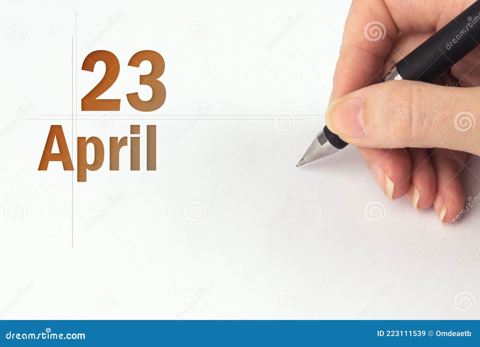 April 23rd Day 23 Of Month Calendar Date The Hand Holds A Black Pen