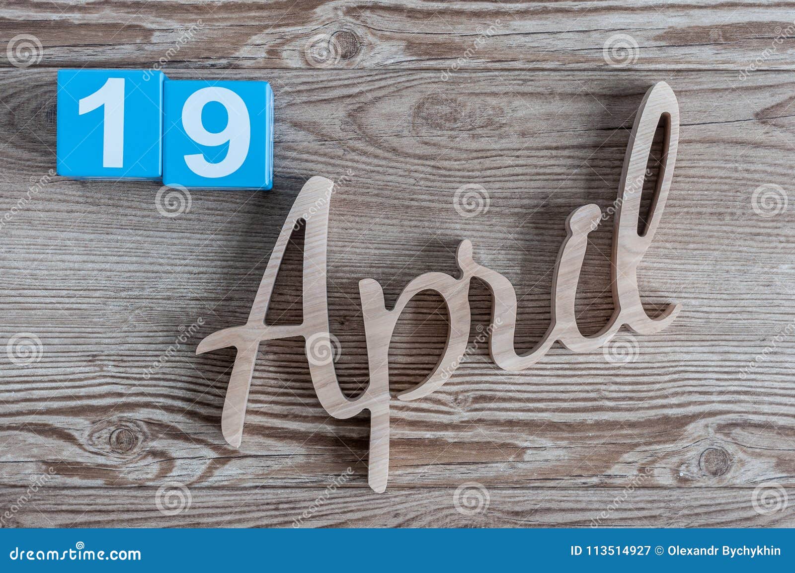 April 19th Day 19 Of April Month Color Calendar On Wooden Background April 19th Day 19 Of April Month Color Calendar On Wooden Background