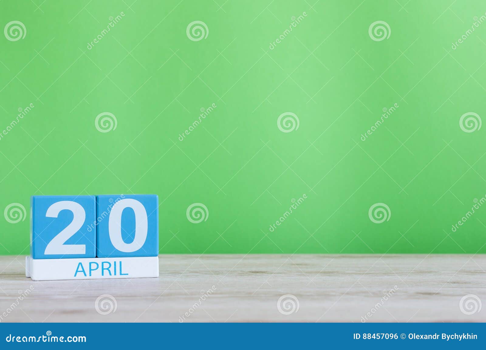 April 20th Day 20 Of Month Calendar On Wooden Table And Green