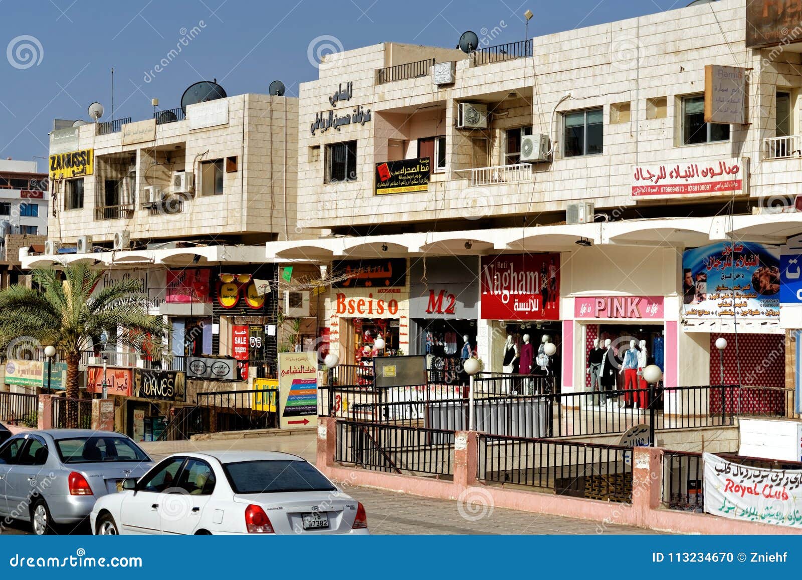 Aqaba, Jordan, March 2018: Main Shopping Street for Tourists with Textile and Jewellery Shops Behind Colourful Facades Editorial Image - Image of center, facade: