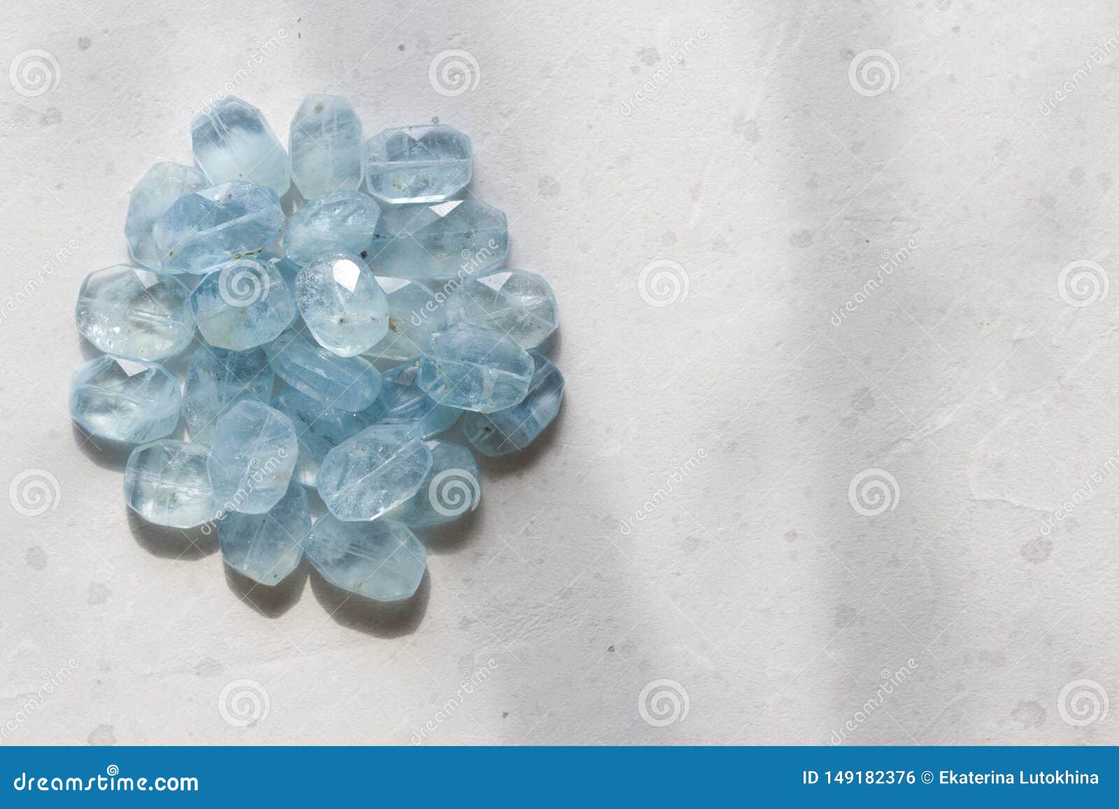 aquamarine stone. natural stone and aquamarine crystals on a white background. beautiful aquamarine stones. copy space for your