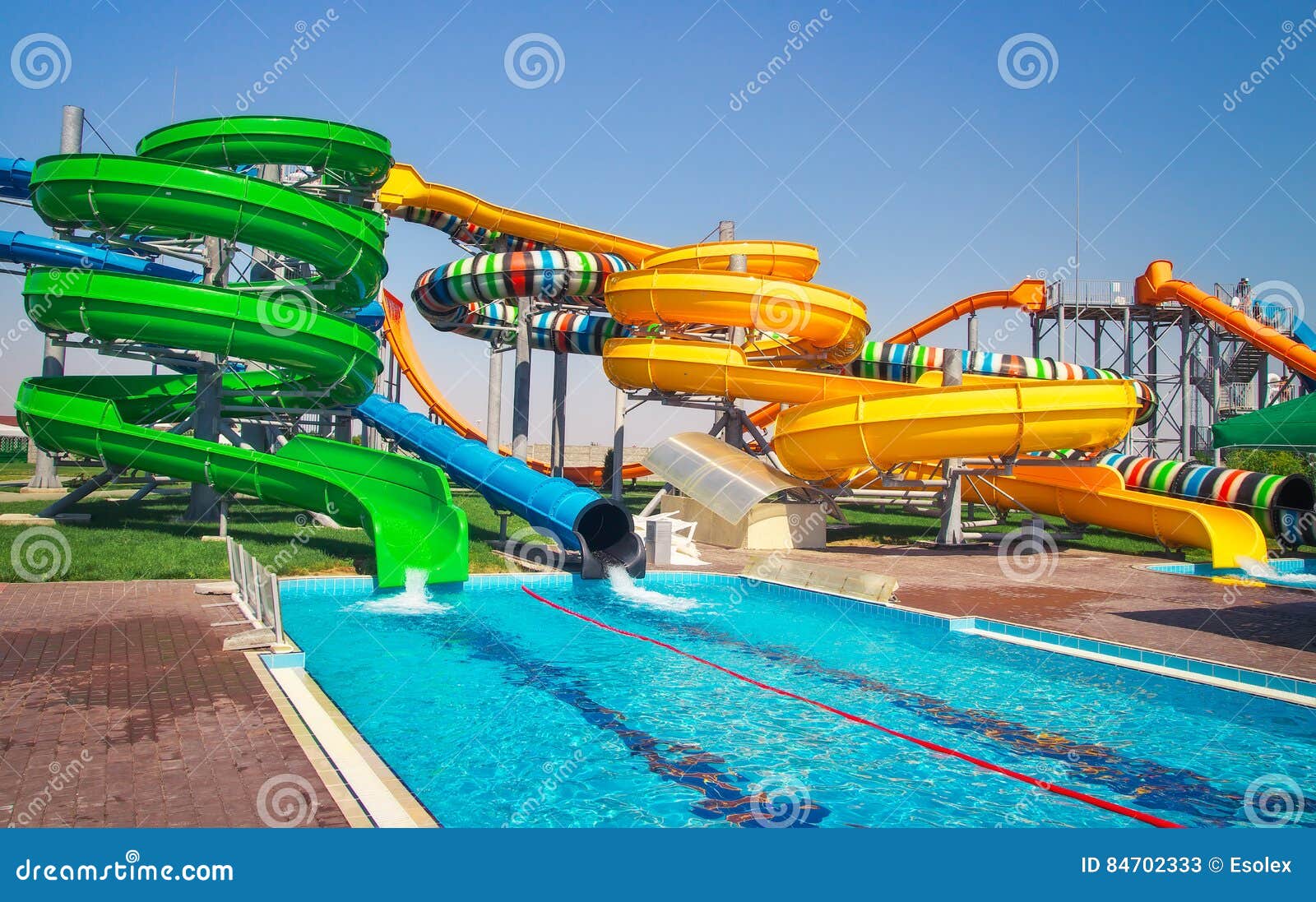 Aquapark sliders with pool stock image. Image of entertaining 84702333