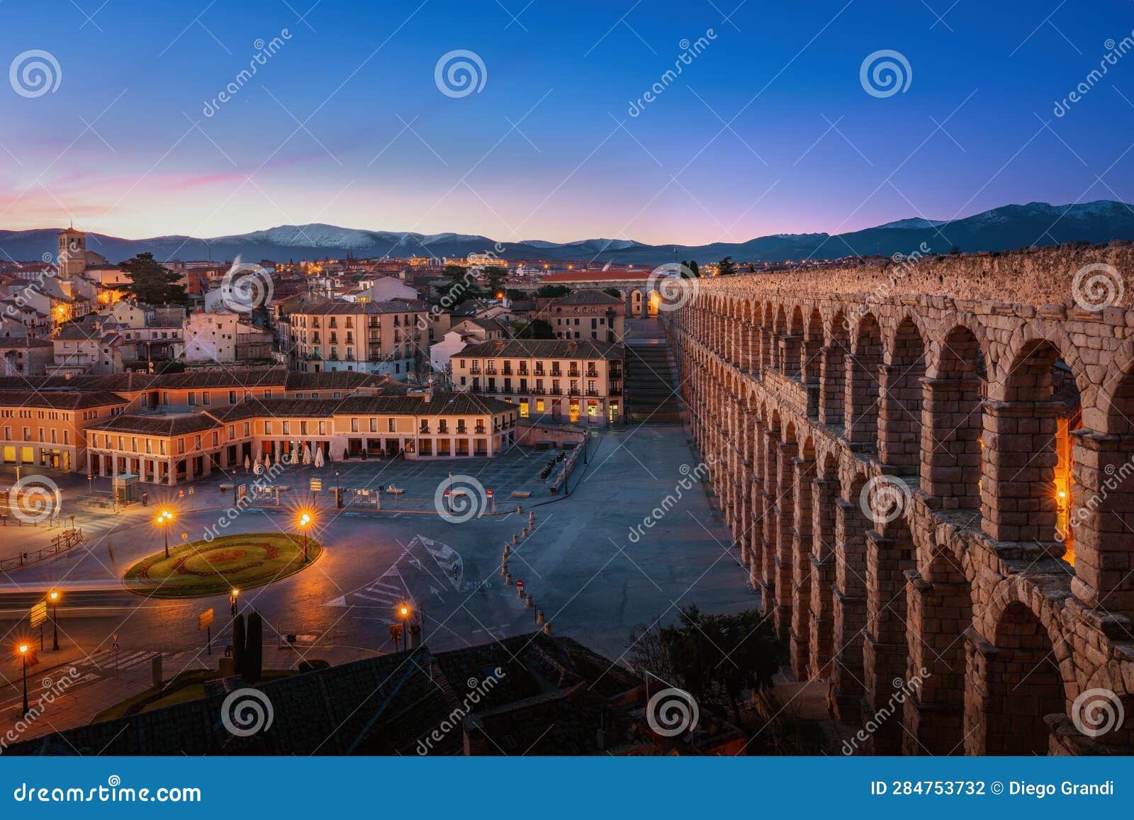 aqueduct of segovia and plaza oriental square at sunset - segovia, spain