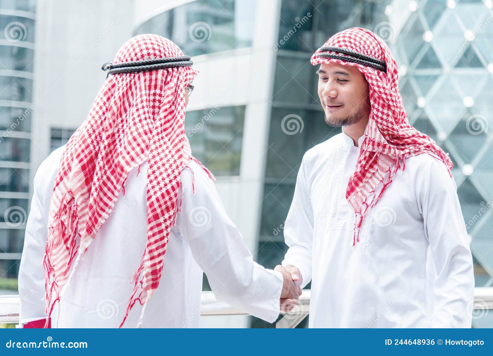 Arab Businessman Muslim Dress Shaking Hands Together in Modern City UAE ...